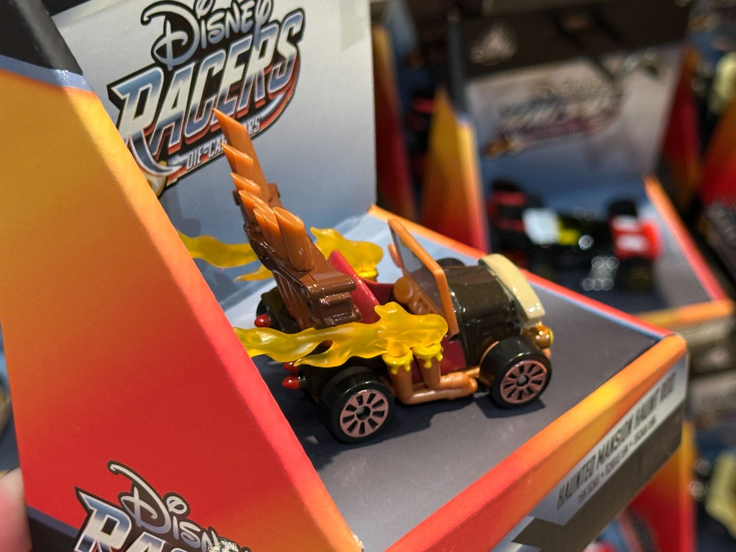 Toy car inspired by Groot from Disney Racers, with wood textures and yellow flames—perfect for Disney World fans.