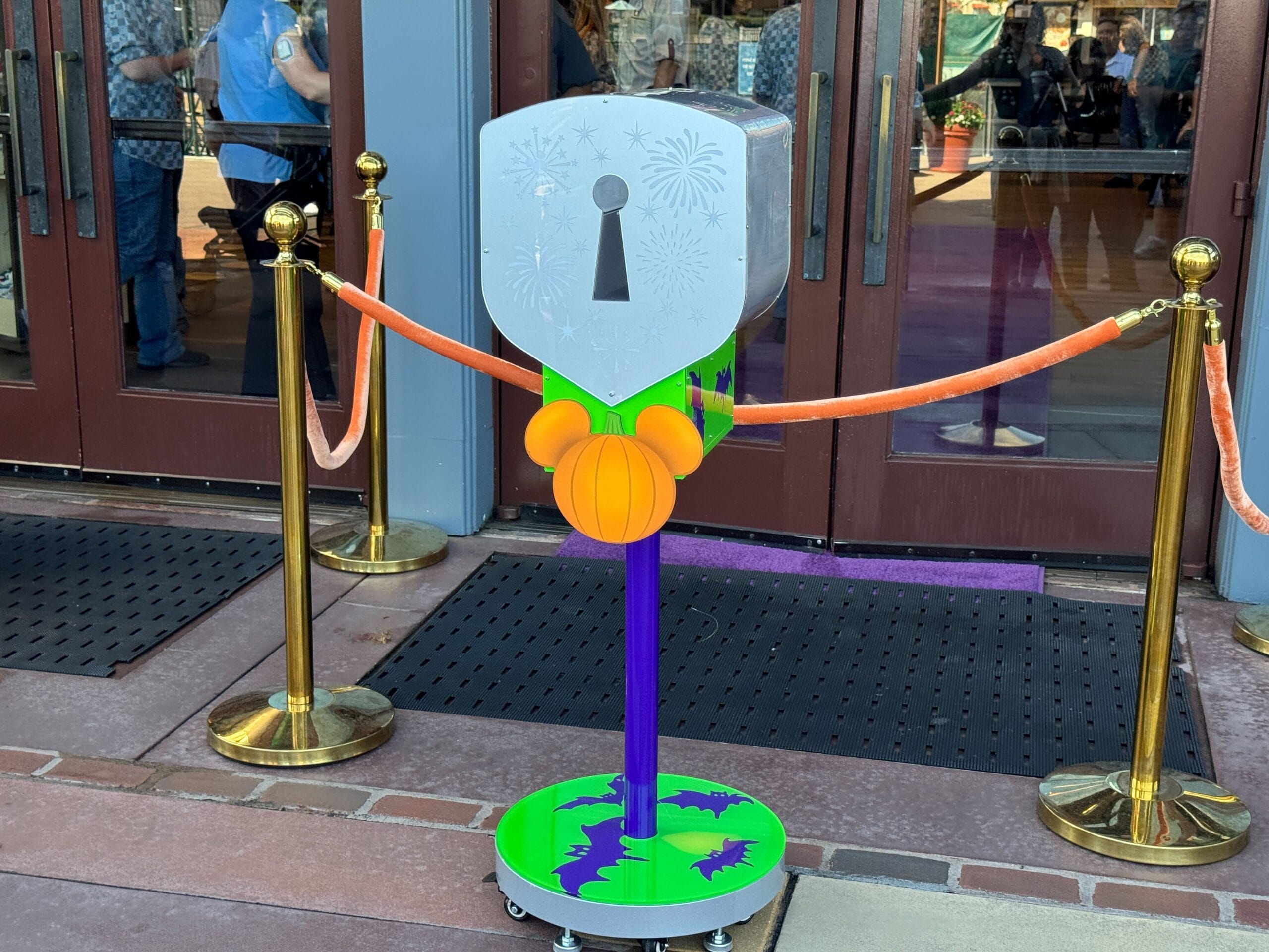 Halloween-themed keyhole box at World of Disney with a Mickey pumpkin, purple bats, and orange ropes for the Opening Ceremony.