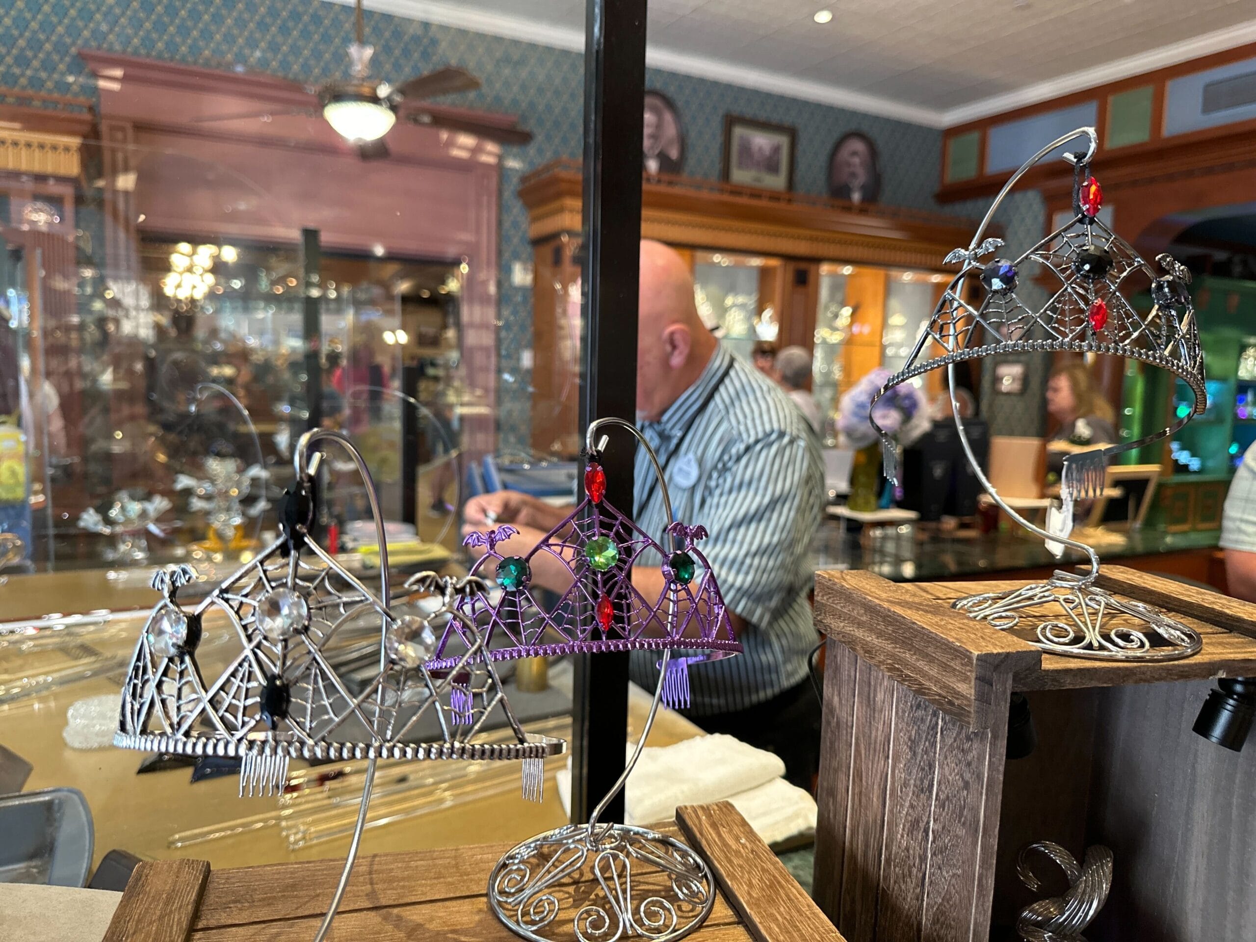 Customizable wire tiaras with colorful beads displayed; perfect for Disney World or as Halloween Tiaras in a vintage-style shop.