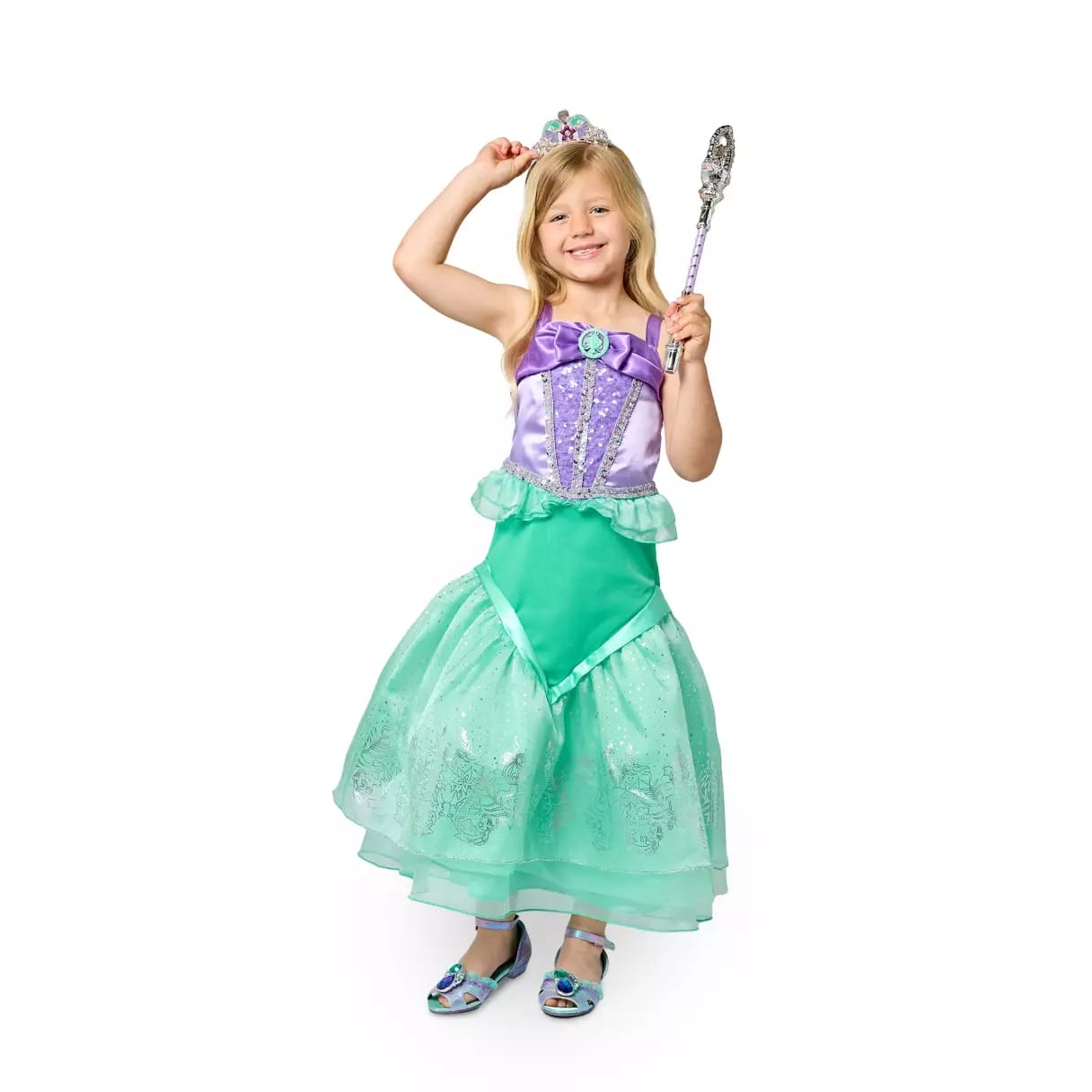 Smiling girl in a Disney Store mermaid princess costume with crown and wand, perfect for Halloween costumes.