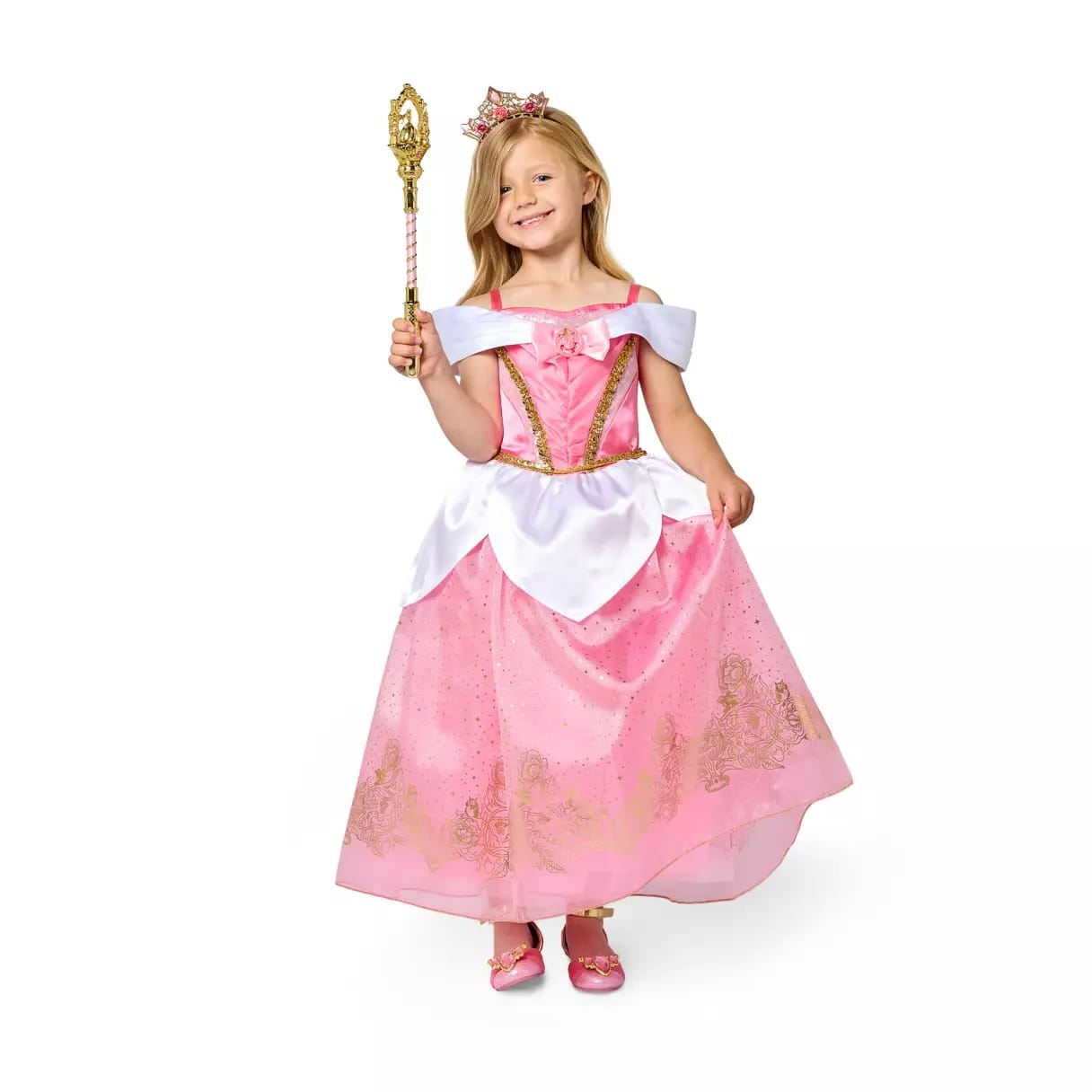 Young girl in a pink princess dress and crown, perfect for Halloween costumes, smiling with a golden wand.