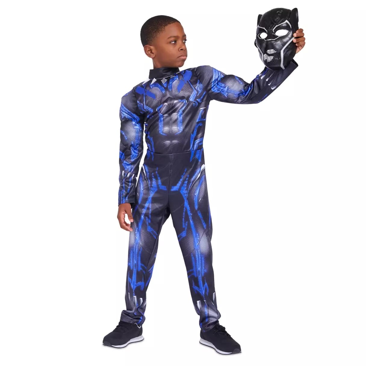 A boy in a Black Panther costume from the Disney Store holds the superhero mask, considering his Halloween costume choice.