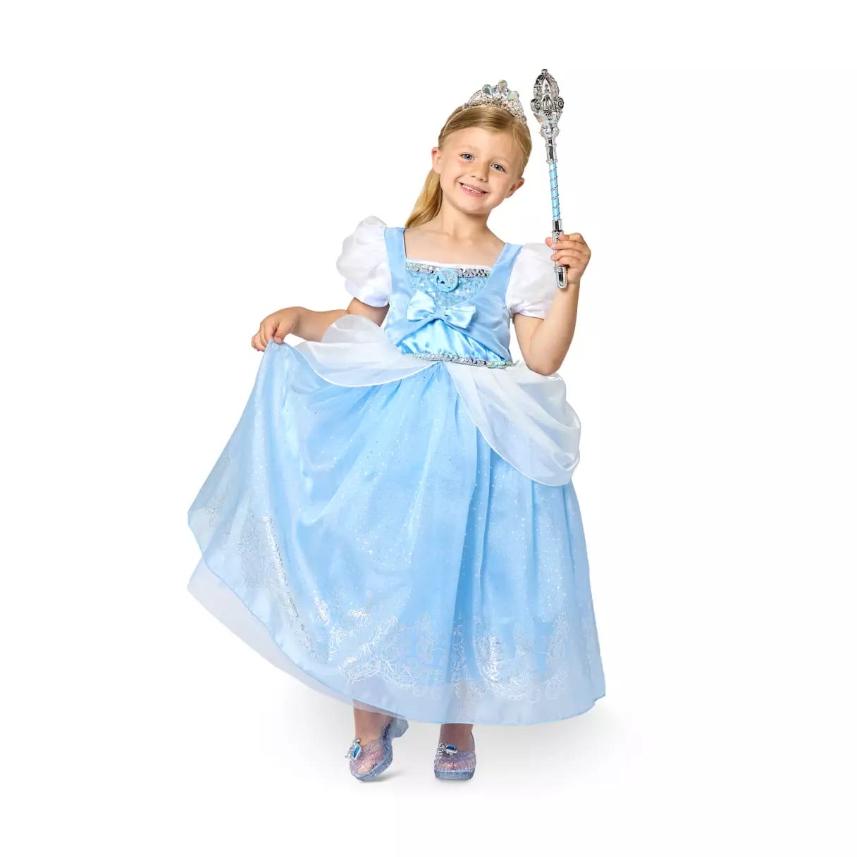 Smiling girl in a blue princess dress and tiara poses with a wand—perfect for Halloween costumes or Disney Store fans.