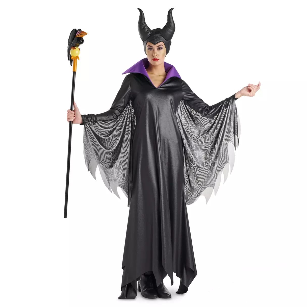 Person in a black and purple horned Disney Store costume holding a staff, dressed as Maleficent from Sleeping Beauty.