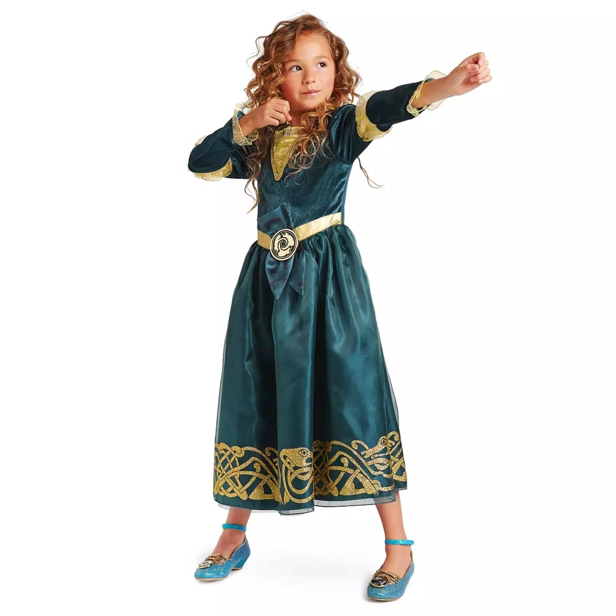 Young child in a dark green Disney Store princess dress poses as if shooting a bow and arrow, one arm extended forward.