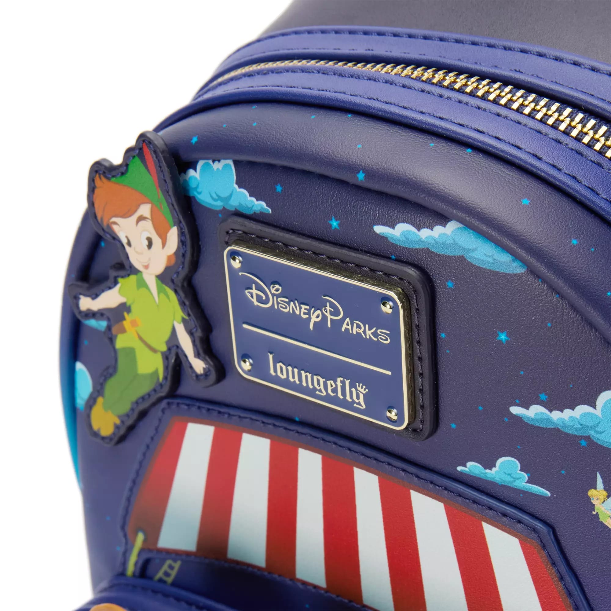 Close-up of a Disney Store Loungefly Backpack featuring Peter Pan's Flight, clouds, and a circus tent design.