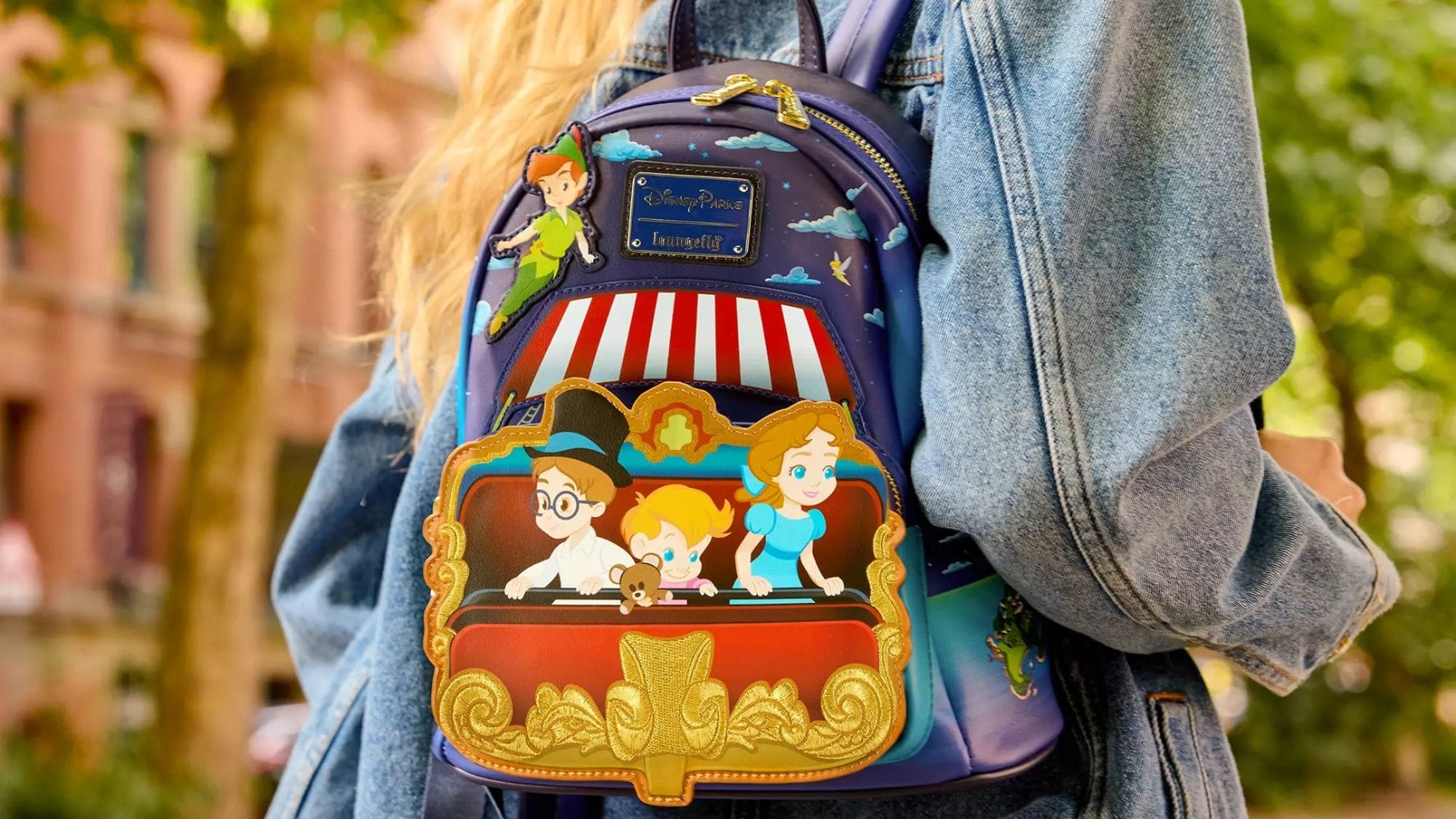 A Loungefly Backpack featuring cartoon characters, available now at the Disney Store.