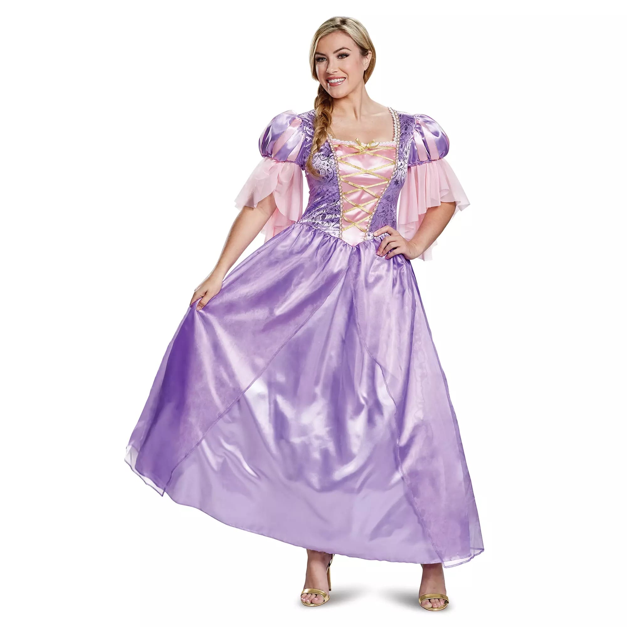 Woman in a long, shiny purple and pink princess dress from the Disney Store, smiling and holding the skirt out.