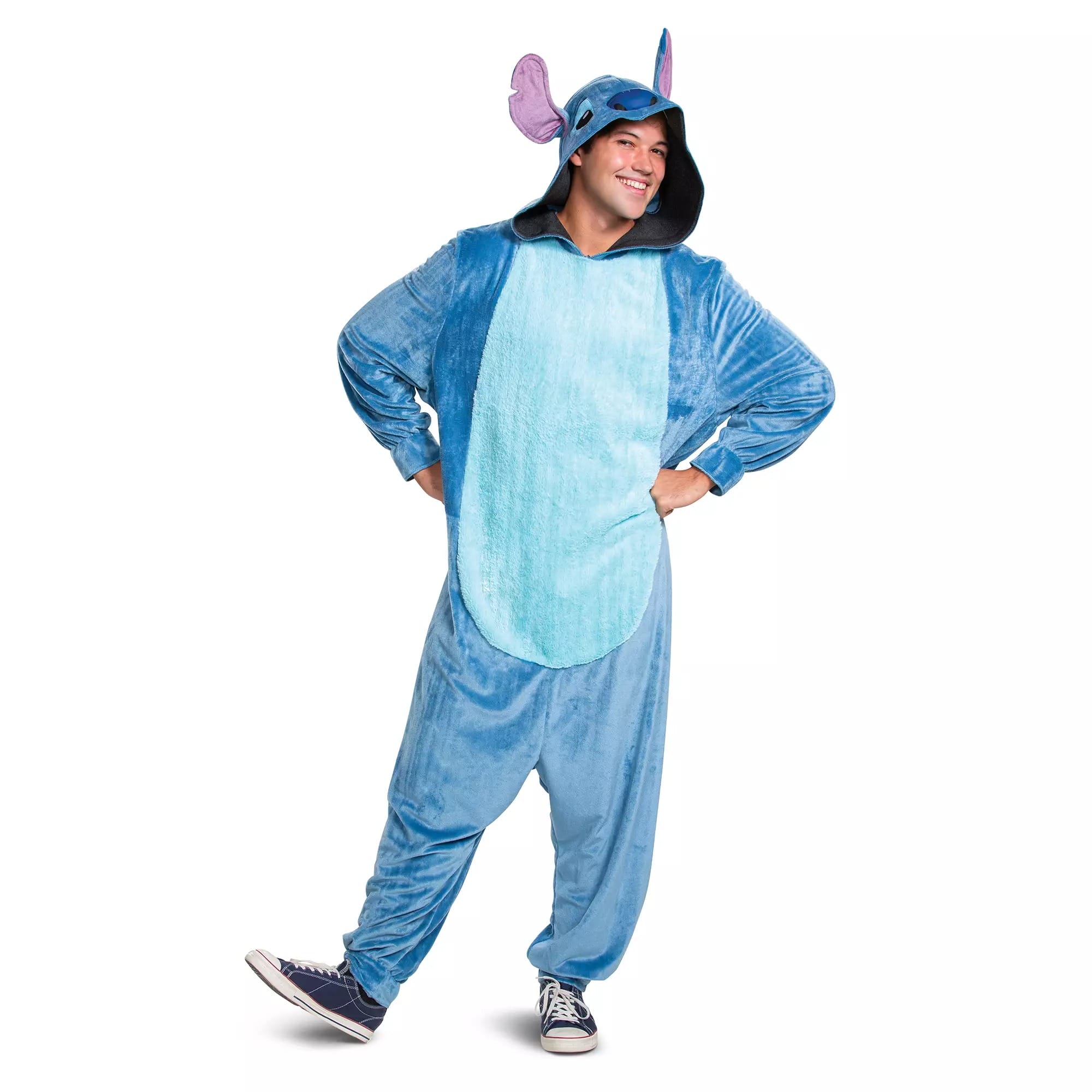 Person in a blue Stitch onesie costume from the Disney Store, standing with hands on hips and smiling for Halloween.