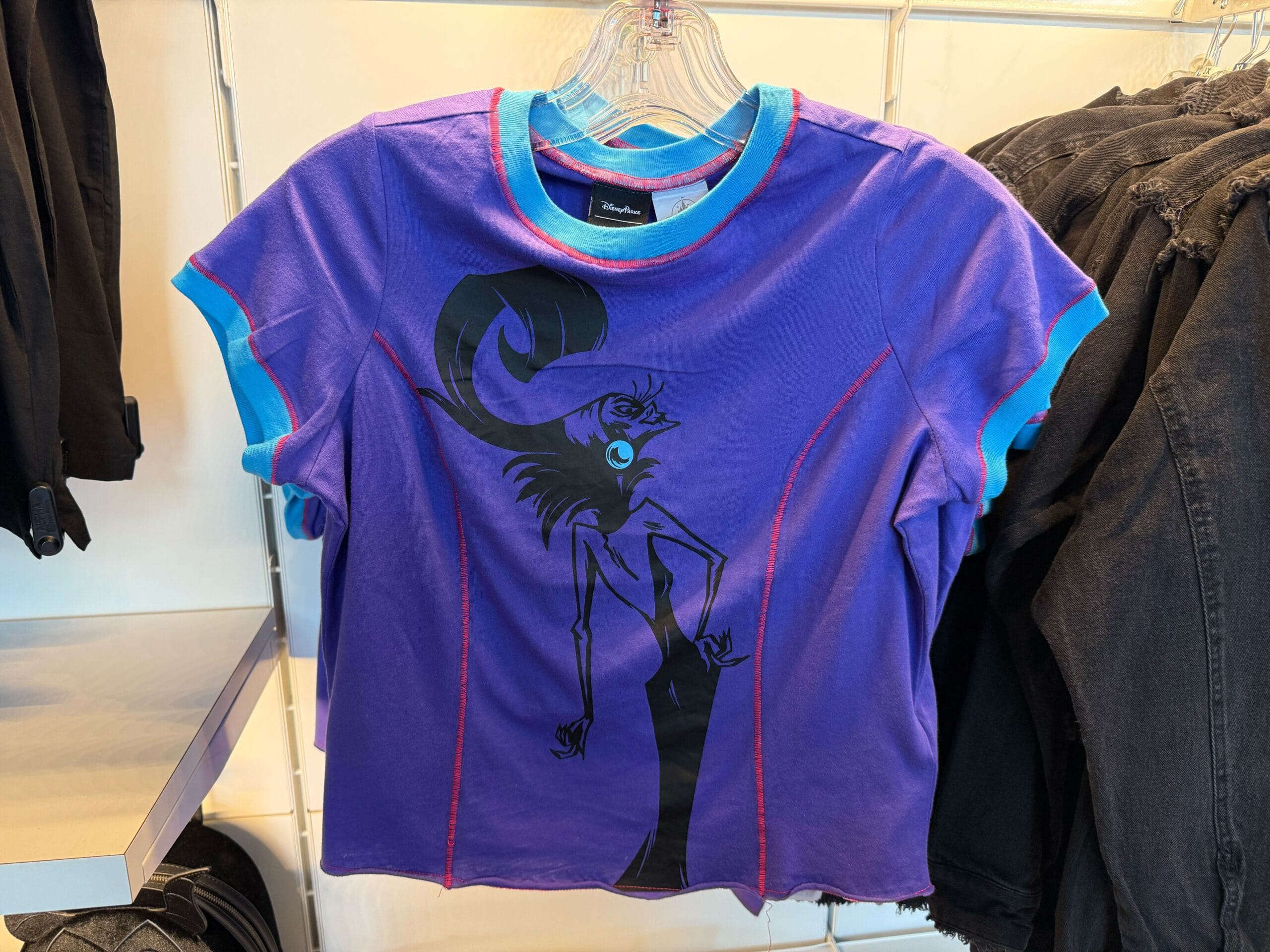 Purple T-shirt with blue trim featuring Yzma’s silhouette—perfect Villains merchandise for Halloween at Disneyland.