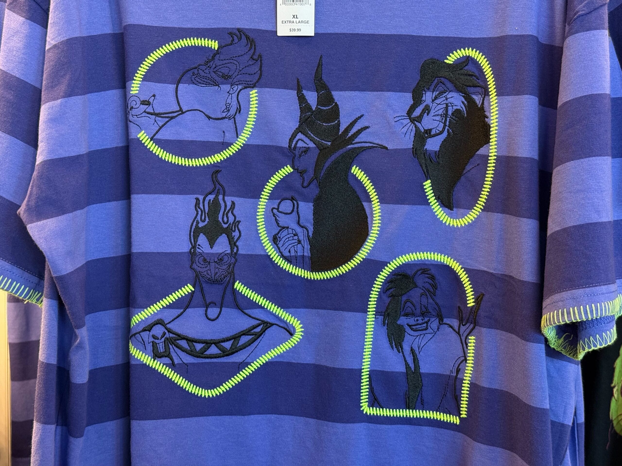 Blue and purple striped shirt featuring embroidered Disney villains—perfect Disneyland villains merchandise.