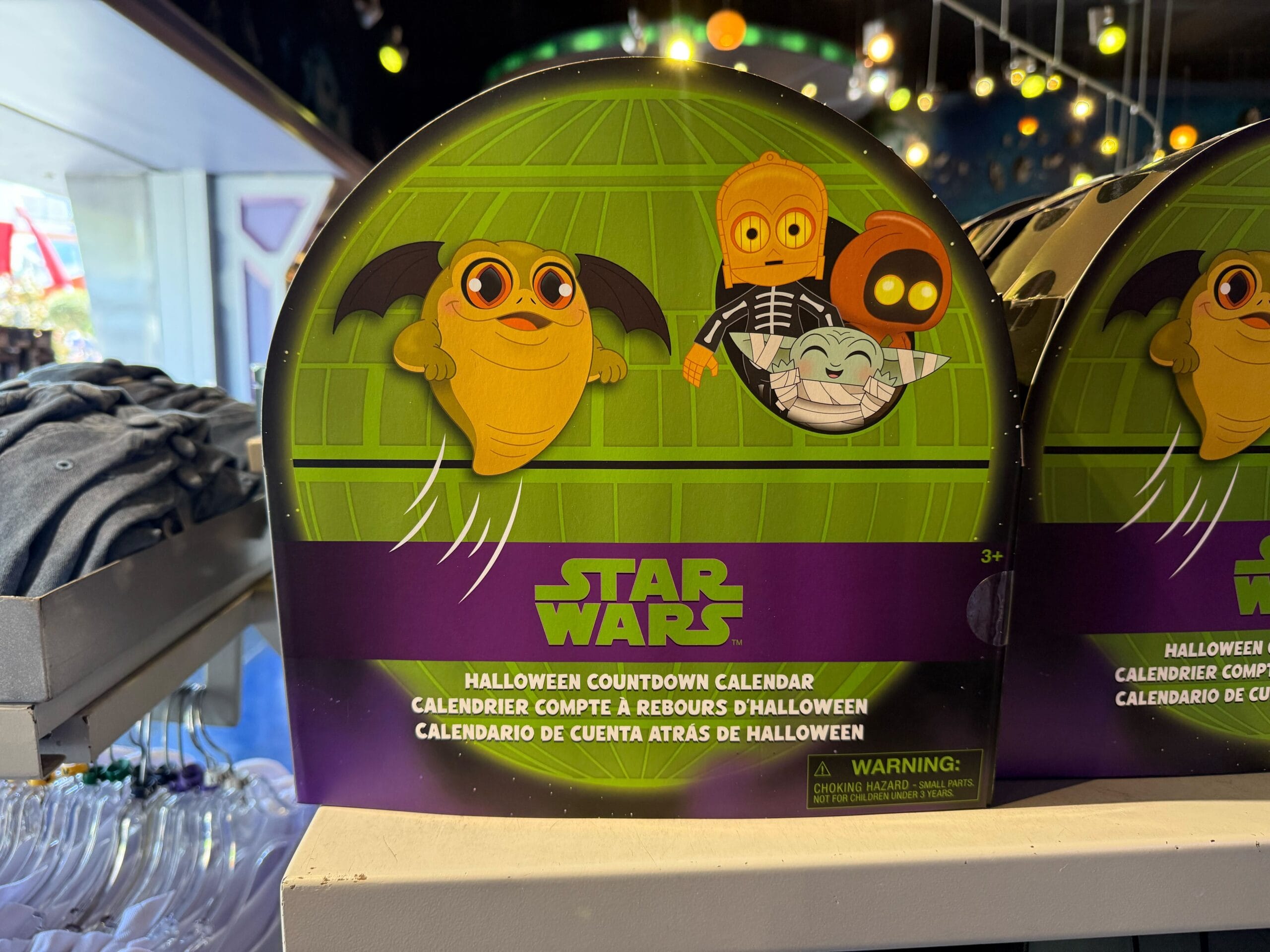 Star Wars Halloween countdown calendar box with cartoon characters, part of Disneyland Halloween merchandise on shelf.