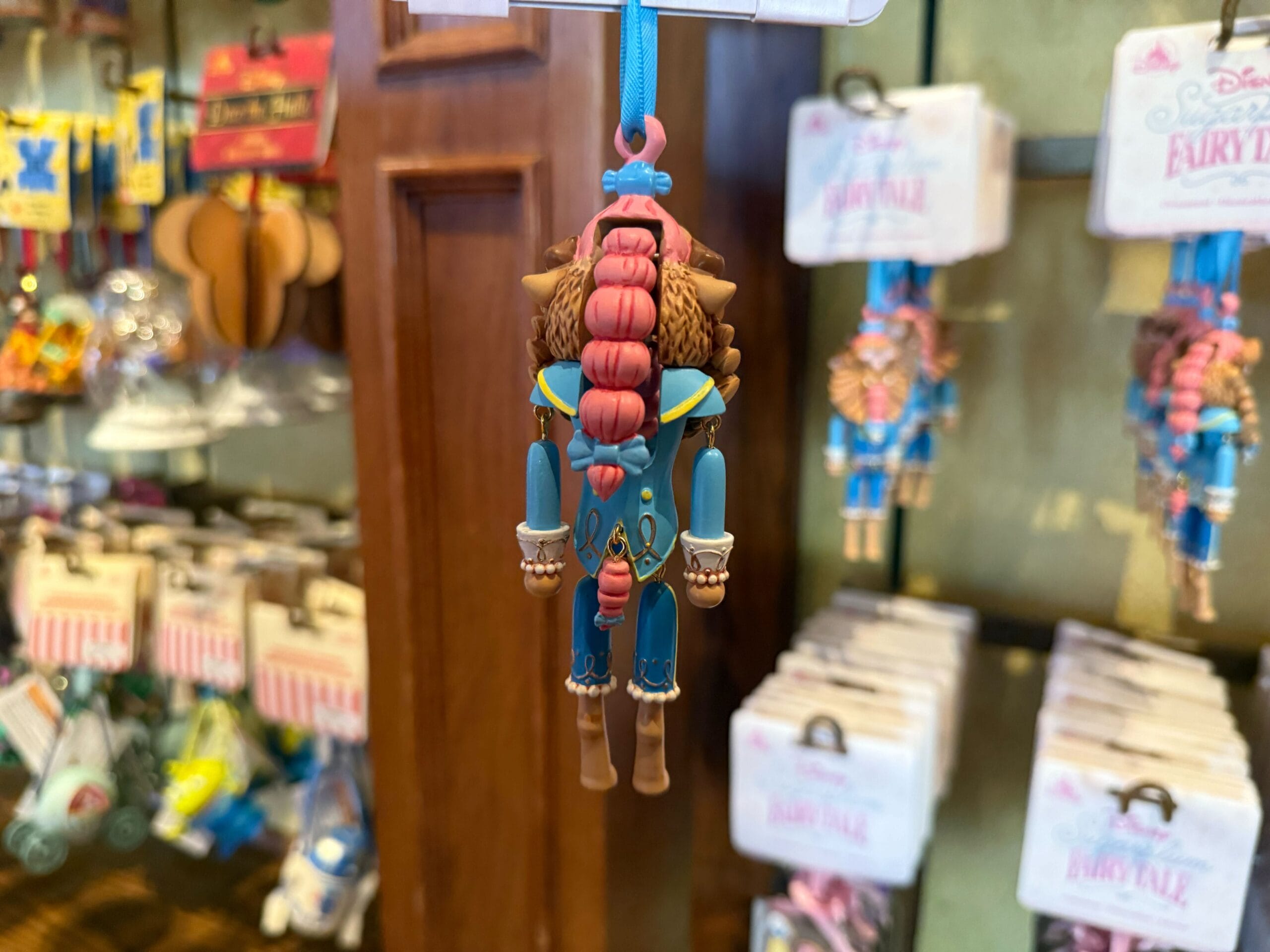 A Beast ornament from "Beauty and the Beast," seen from the back, shines in an Ornament Collection at Disneyland.