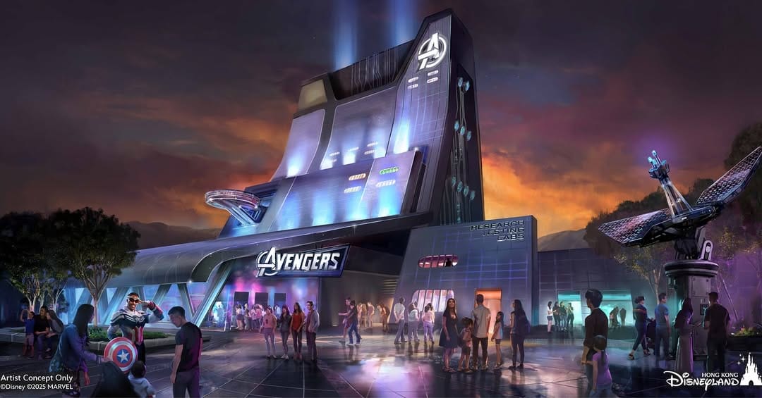 Concept art of Avengers-themed building at Disneyland at sunset, with people walking and colorful lights illuminating the scene.