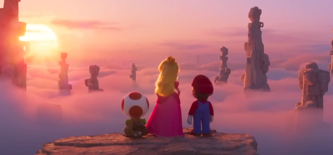 Mario, Princess Peach, and Toad overlook misty pillars at sunrise—could this hint at a Super Mario Bros. Movie sequel?