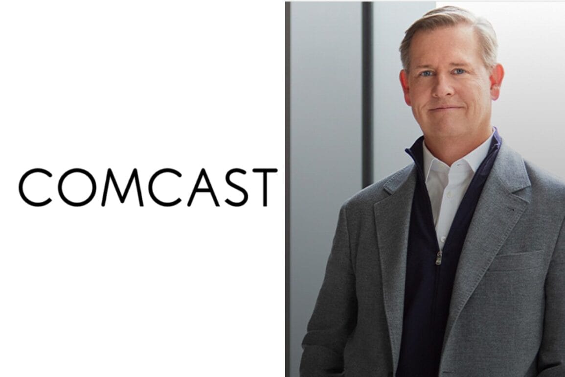 A man in a suit stands next to the Comcast logo, representing the Universal Parent Company.