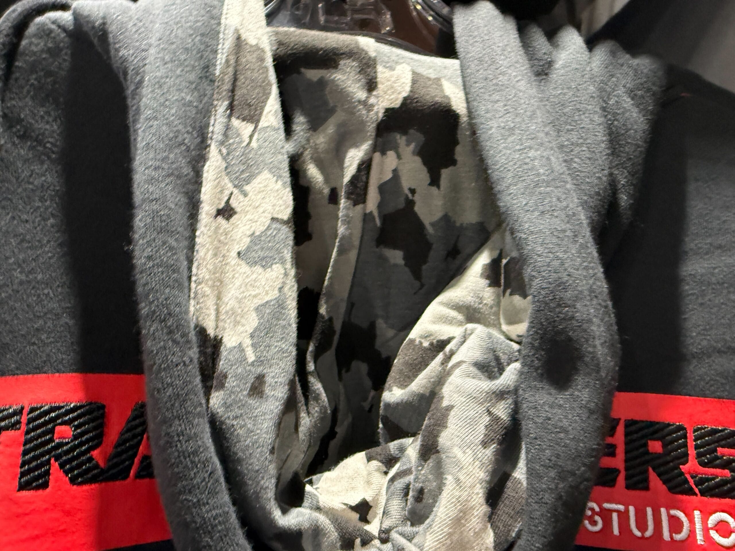 A grey and black camouflage clothing on a swinger