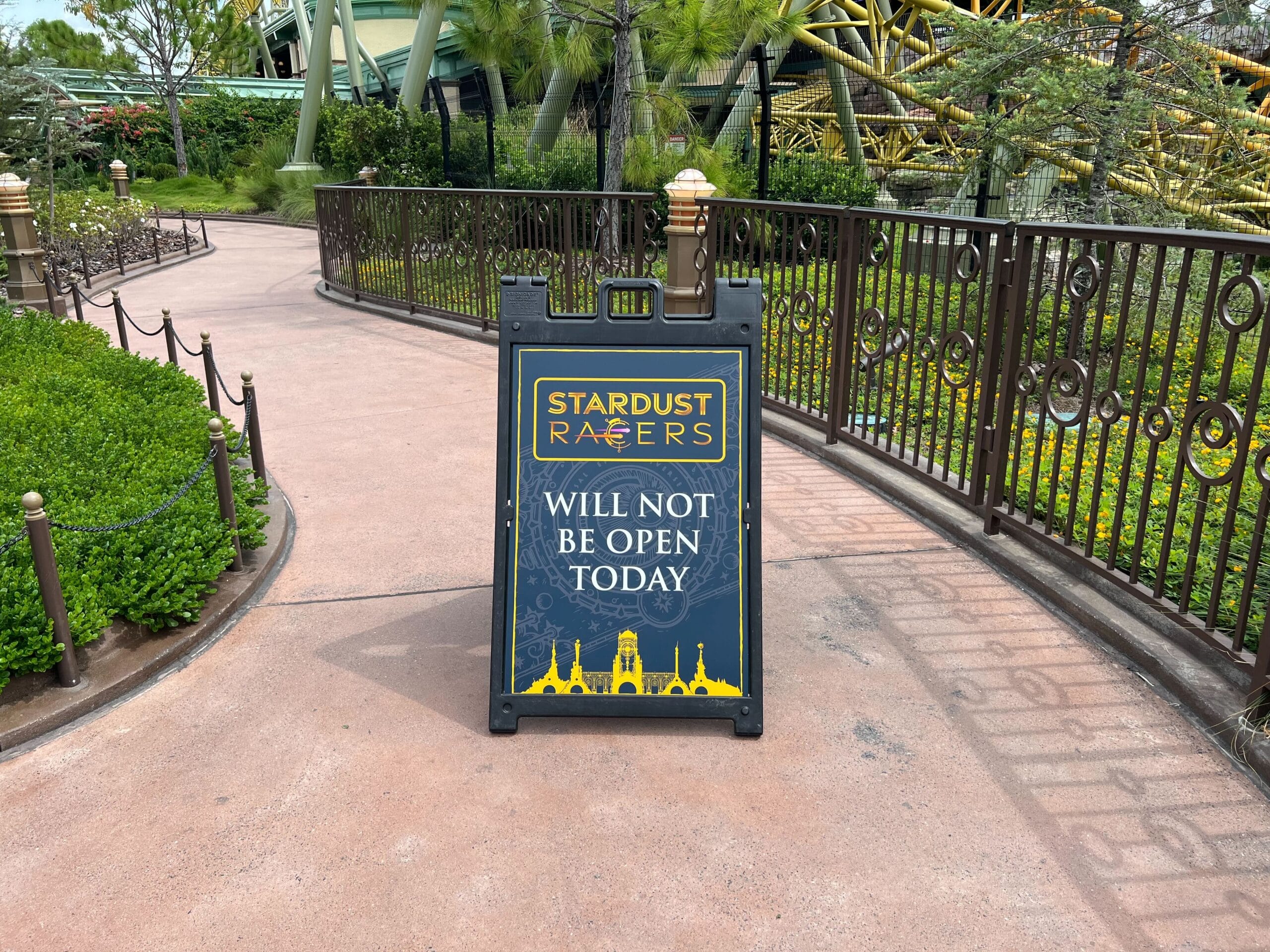 A sign near the roller coaster and greenery at Universal Epic Universe reads "Stardust Racers will not be open today.