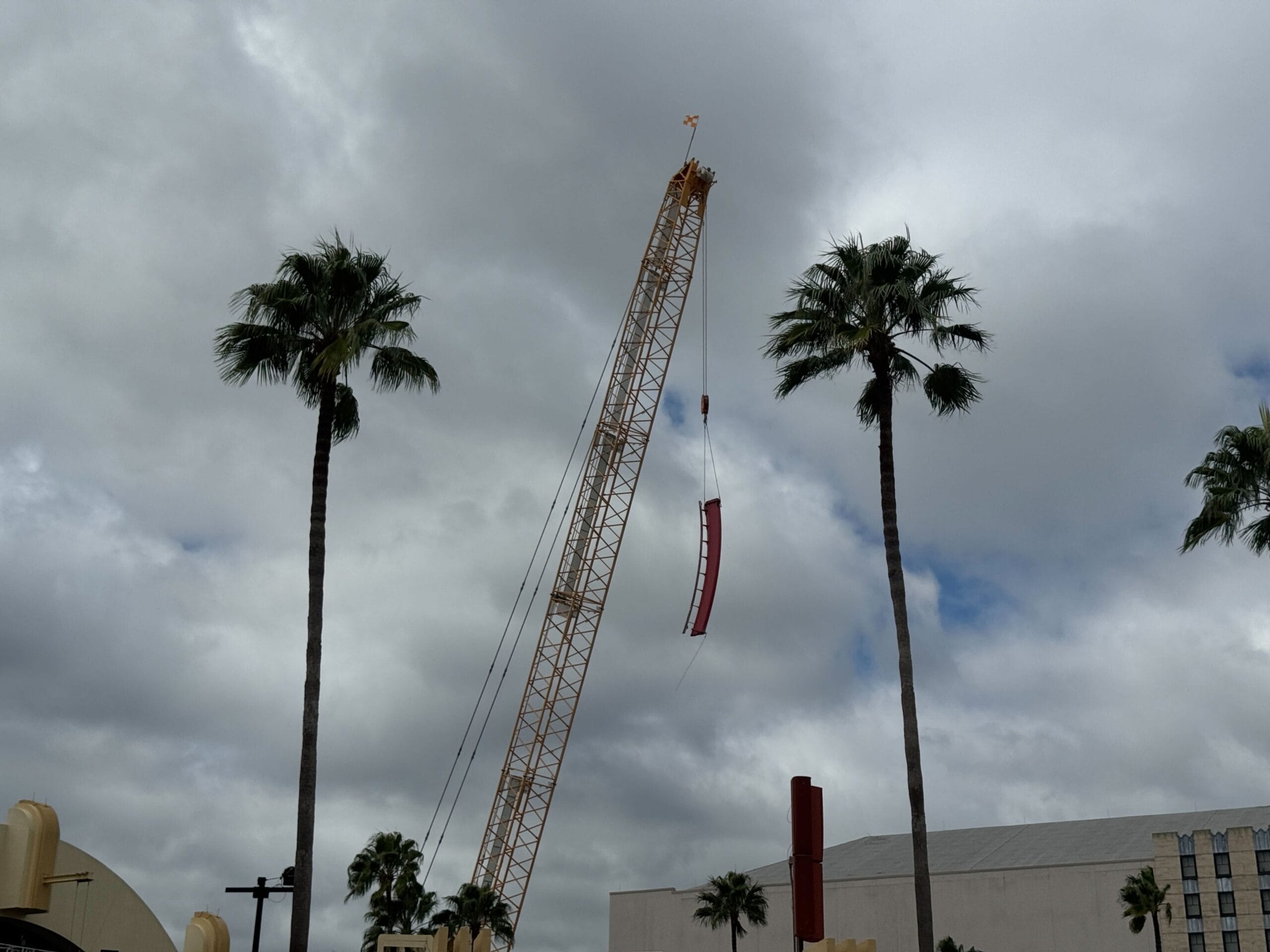 A crane lifts a beam, reminiscent of the height reached on Rip Ride Rockit.