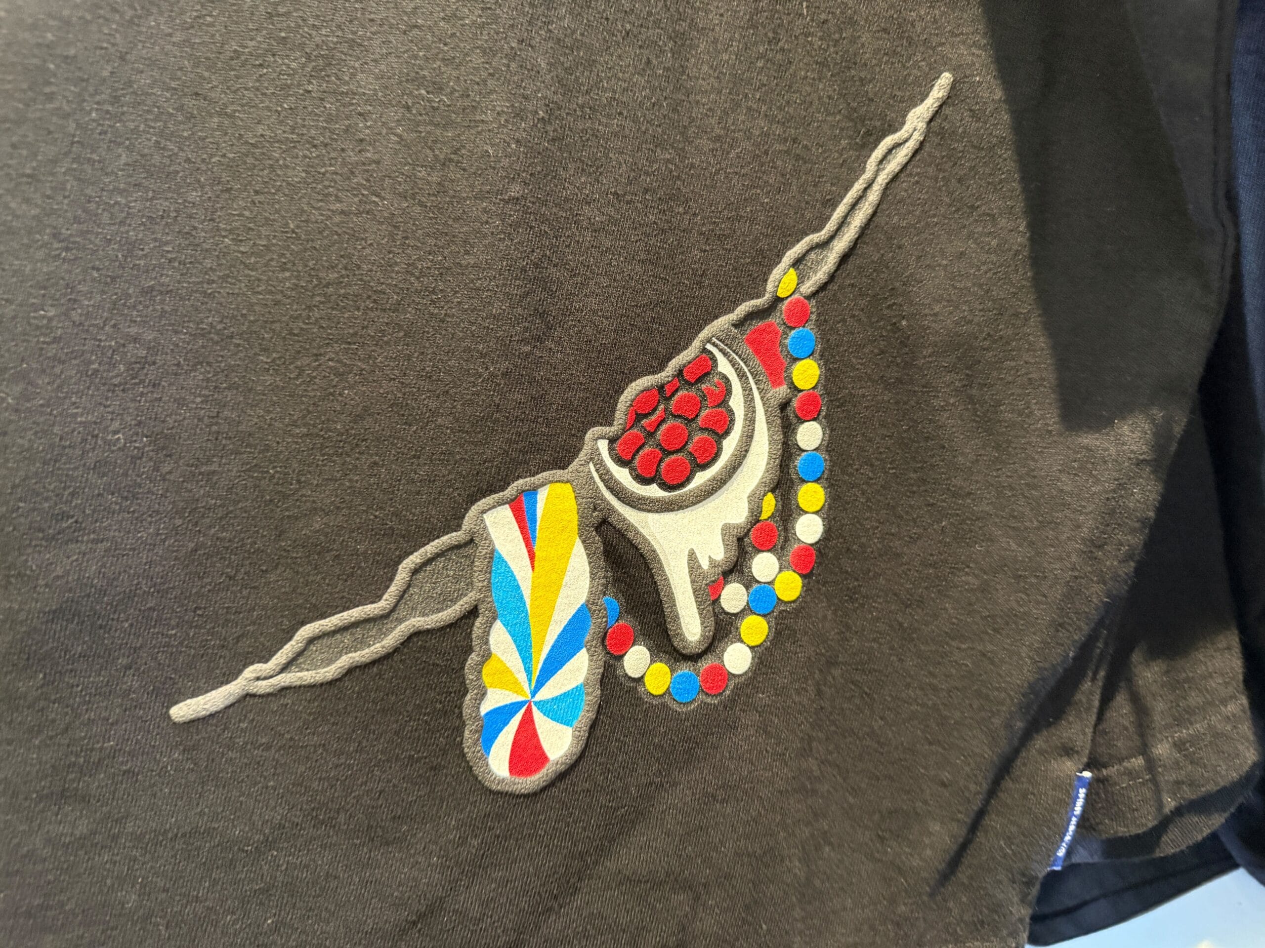 Embroidered feather, beads & horn with red berries—unique HamiKuma Merchandise inspired by Halloween Horror Nights 2025.