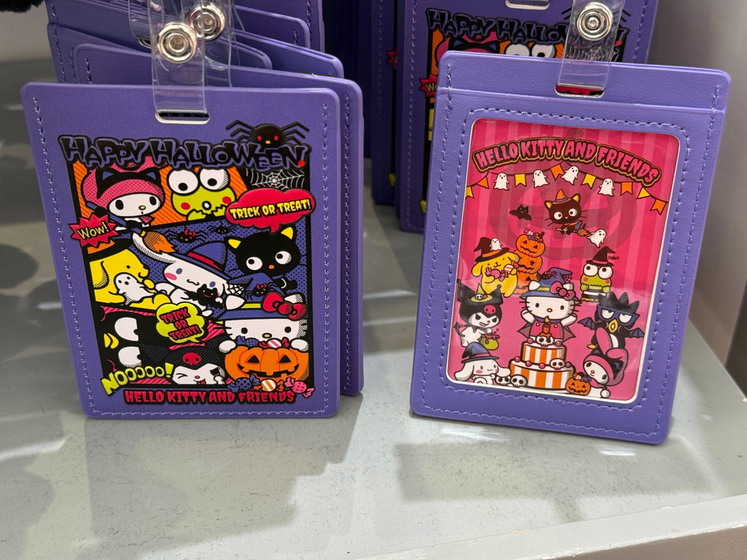 Two purple Hello Kitty Halloween-themed cardholders, perfect Halloween merchandise from Universal Studios Hollywood.