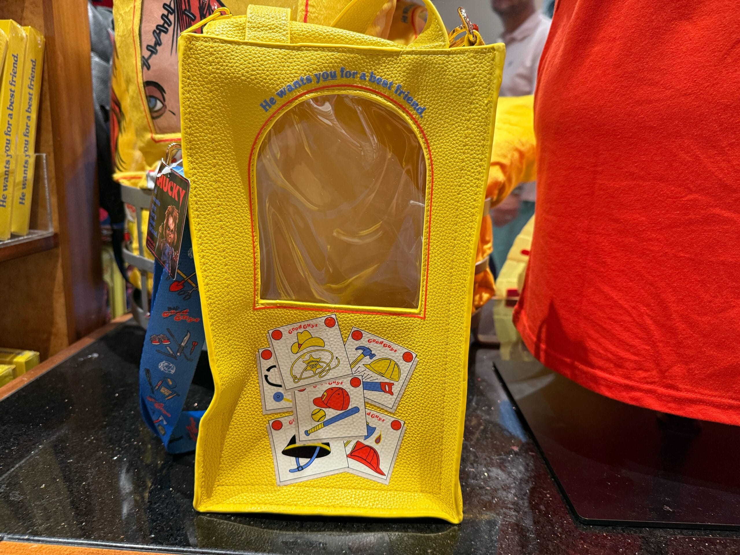 A yellow bag with a clear window and Monopoly card art, exclusive HHN Merch 2025 at Universal Studios Hollywood.
