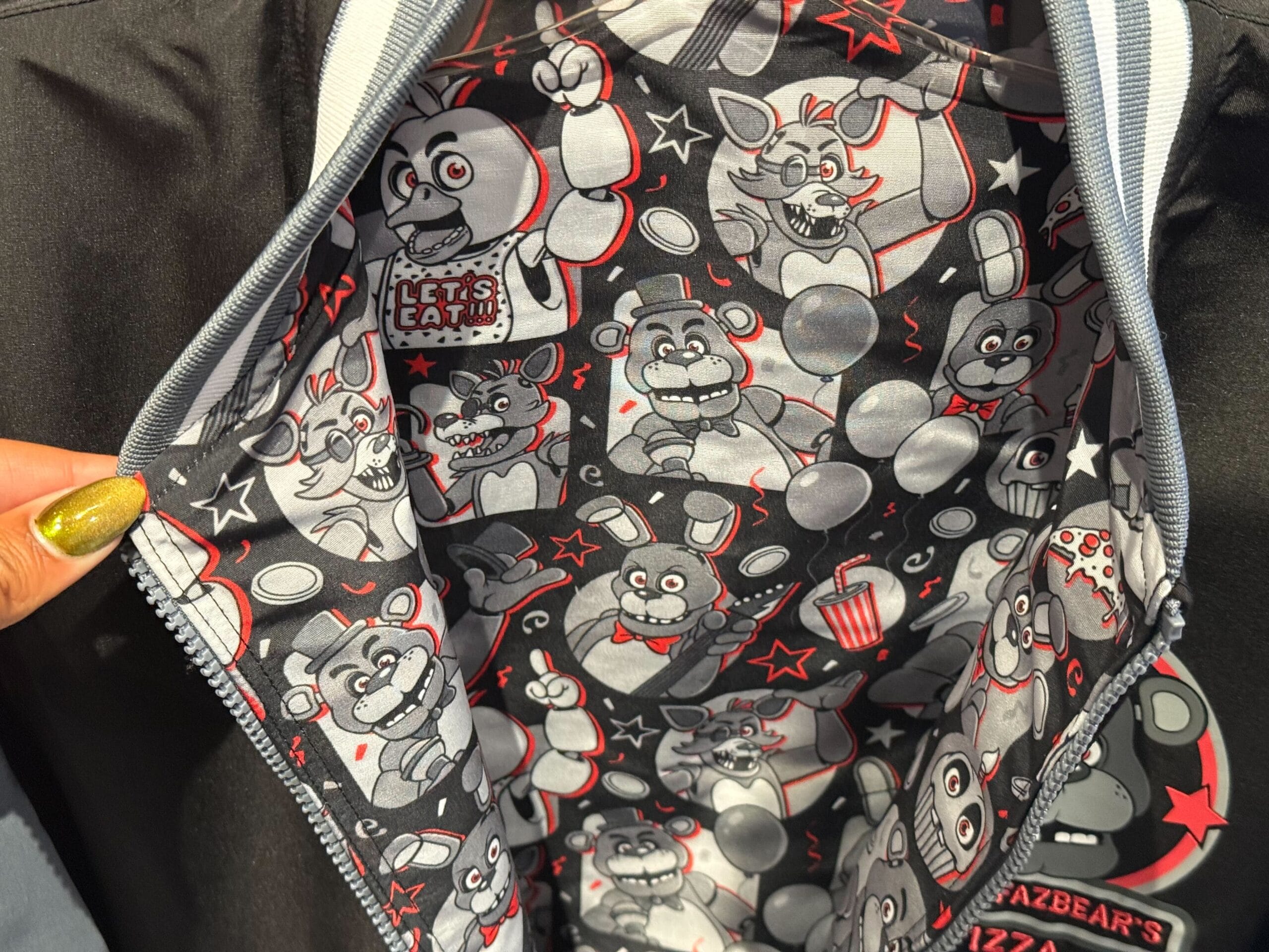 Inside of a jacket featuring Five Nights at Freddy's animatronics—part of HHN Merch 2025 at Universal Studios Hollywood.