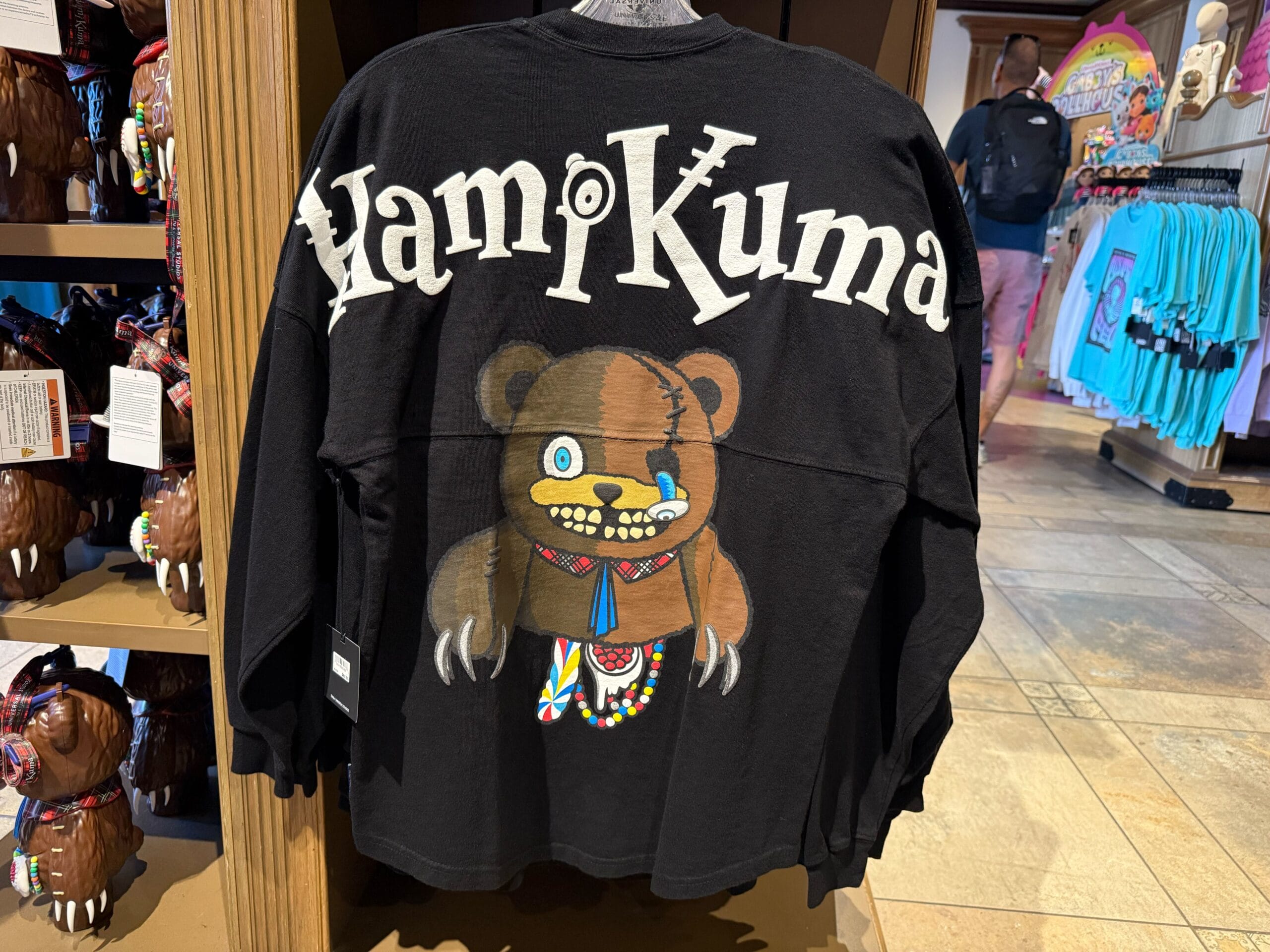 Black shirt featuring "Yami Kuma" and a patchwork bear, perfect for Halloween Horror Nights Merchandise collectors.