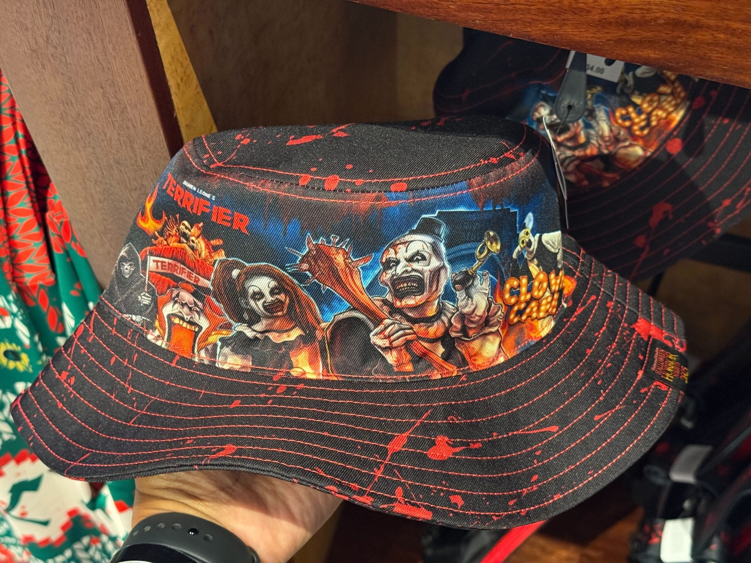A bucket hat with horror clowns and "TERRIFIER"—perfect HHN Merch 2025 for Universal Studios Hollywood fans.
