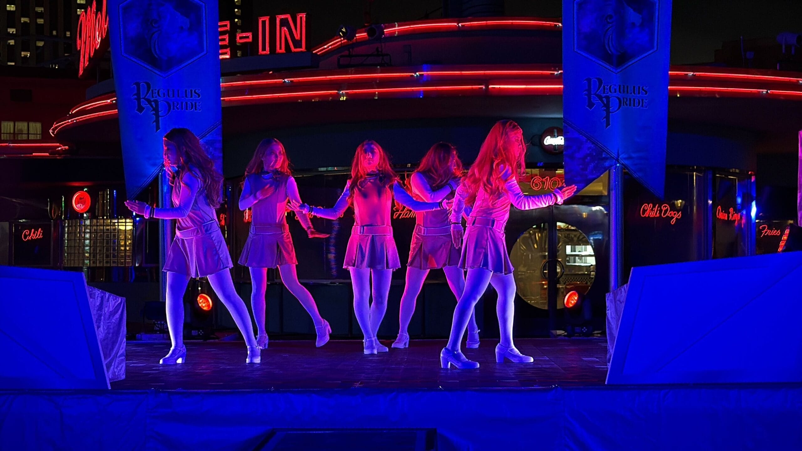 Five women in matching outfits perform a choreographed dance at Universal Studios Japan's Halloween Horror Nights.