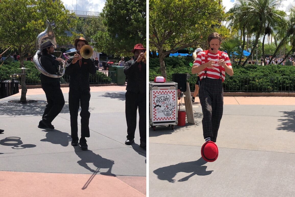 The HollyGroove Swinging Band plays while a mime delivers a record juggling performance in a sunny park with trees and people.