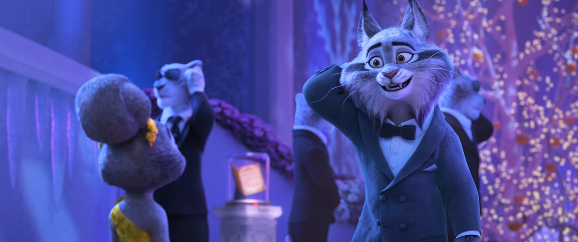 An animated lynx in a tuxedo smiles awkwardly at a fancy event with other animals in evening wear.