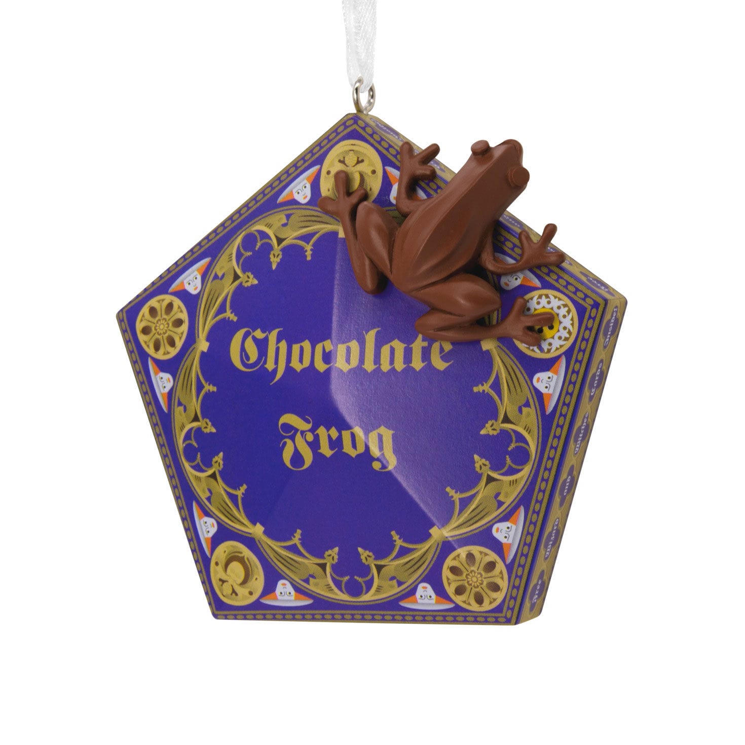 A pentagon-shaped purple Chocolate Frog box with gold accents and a 3D brown frog