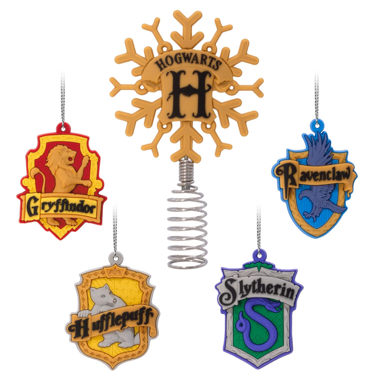 Five Hogwarts house crests with a snowflake “H” topper, resembling Universal Studios ornaments