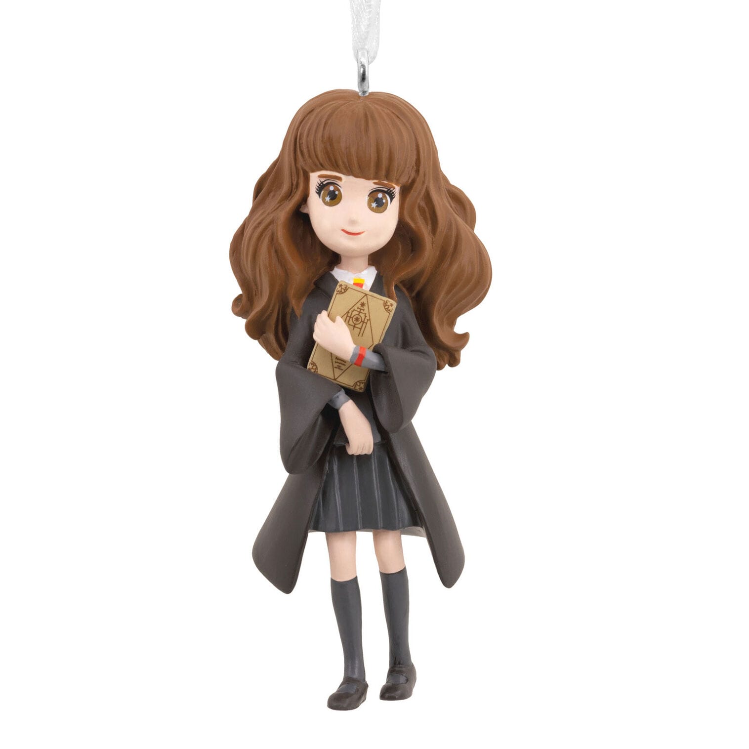 Chibi-style girl in a black robe with brown wavy hair, holding a book