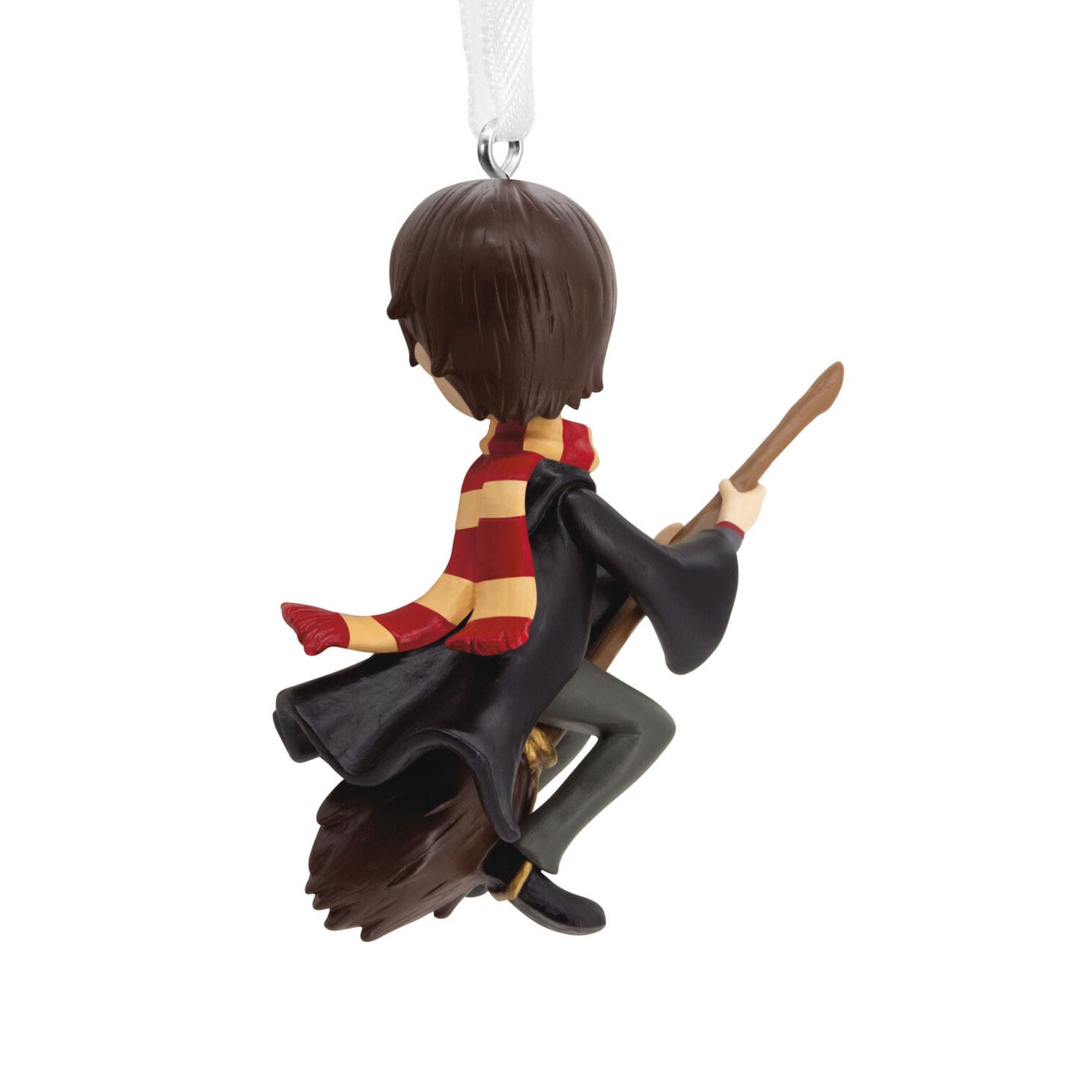 Hallmark Ornament: Character in a red and yellow scarf on a broomstick, viewed from behind, hanging ribbon
