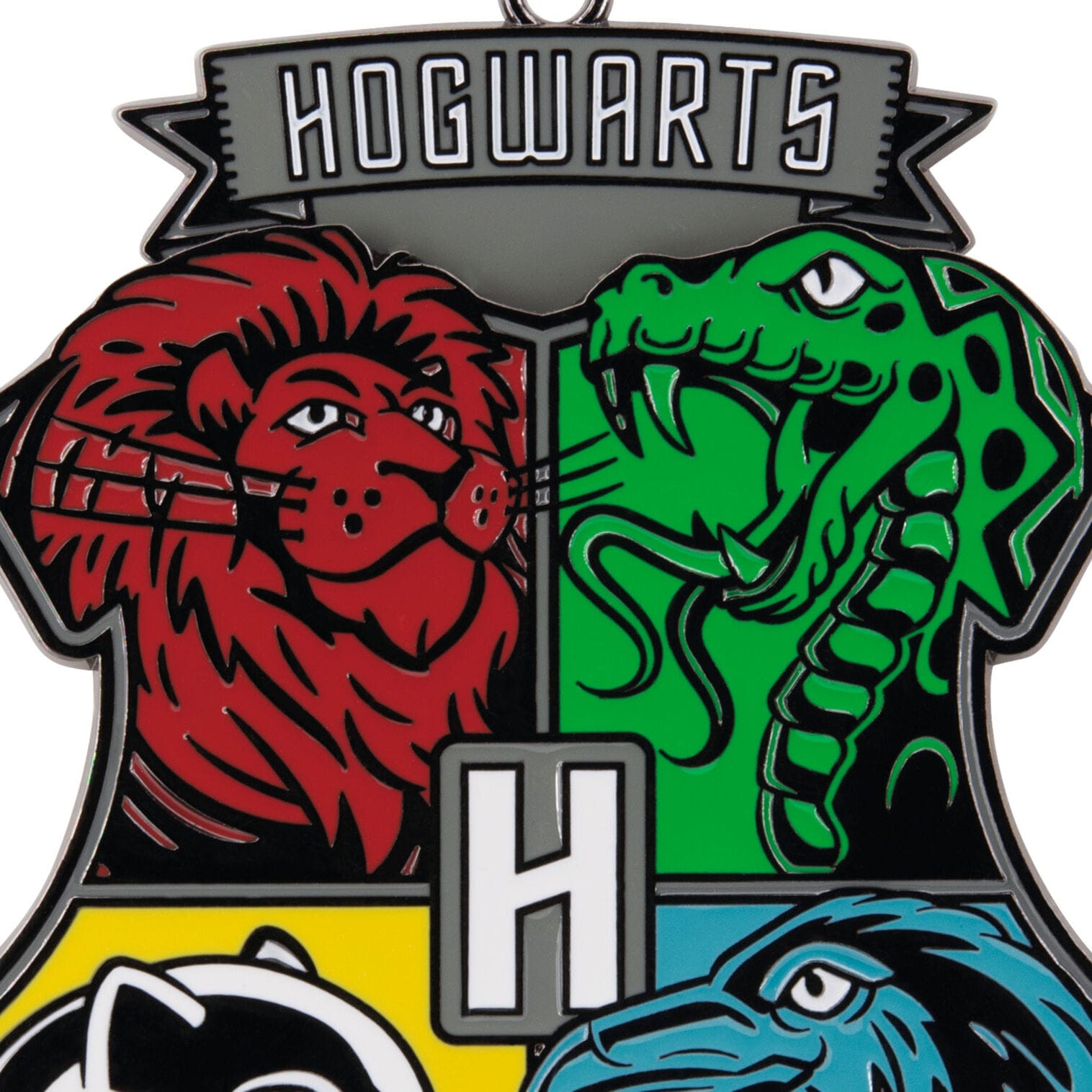 A Hogwarts crest with lion, snake, badger, and eagle
