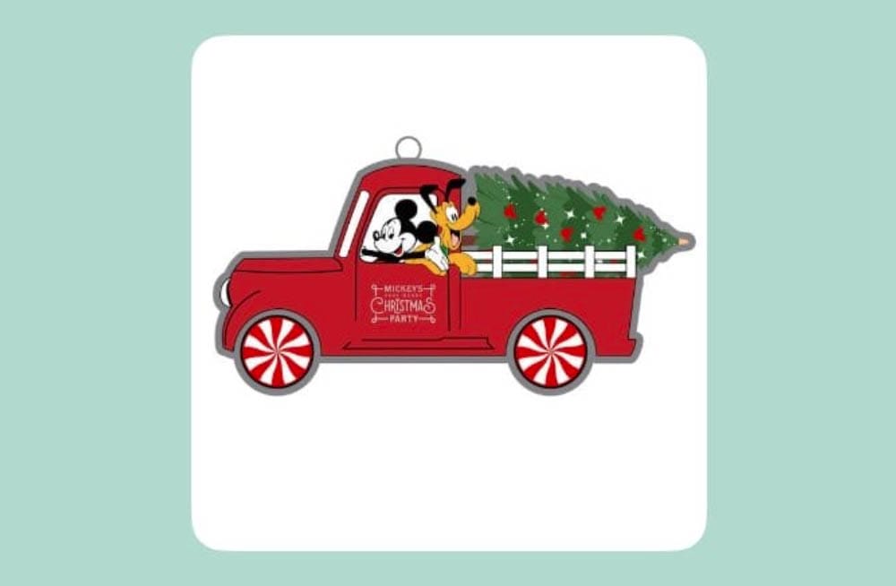 Mickey Mouse and Pluto ride in a red truck with a Christmas tree, celebrating Disney Parks’ holiday spirit—just like Main Street USA.