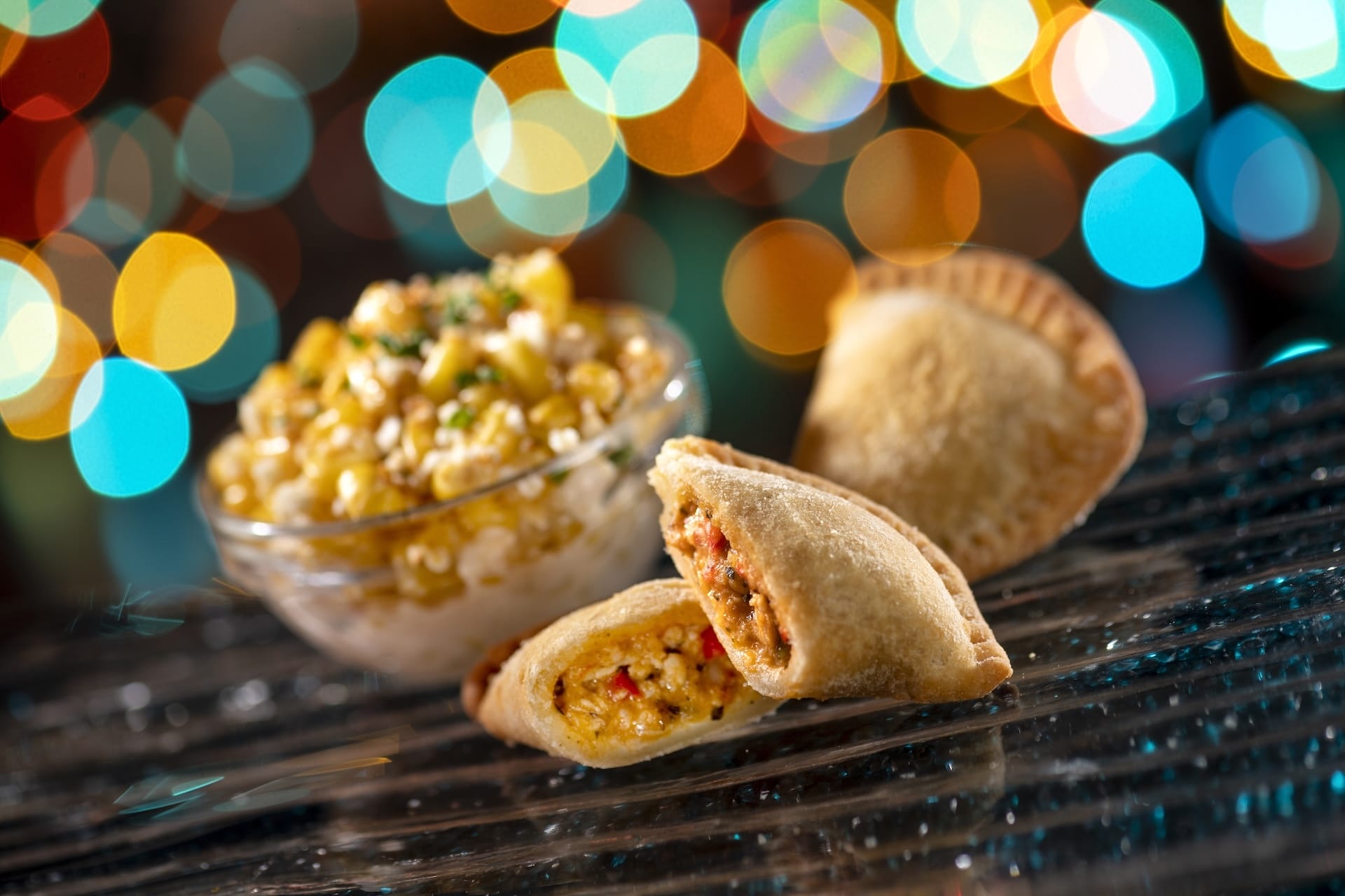 Savor two empanadas with corn salad—ideal bites for Disney Jollywood Nights at Walt Disney World in 2025.