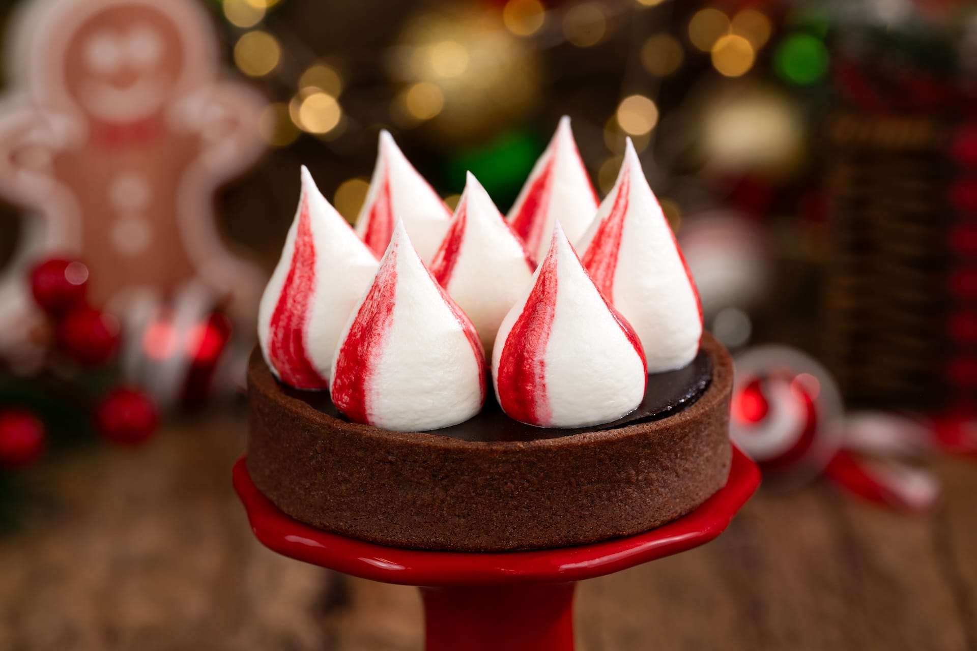 Chocolate tart with festive meringue peaks, a 2025 menu treat at Mickey’s Very Merry Christmas Party in Walt Disney World.