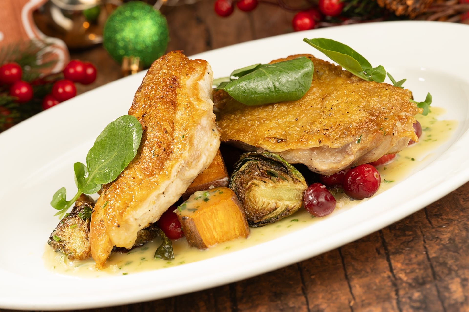 Roast chicken with golden skin, festive greens, and squash—a 2025 holiday favorite at Disney Parks worldwide.