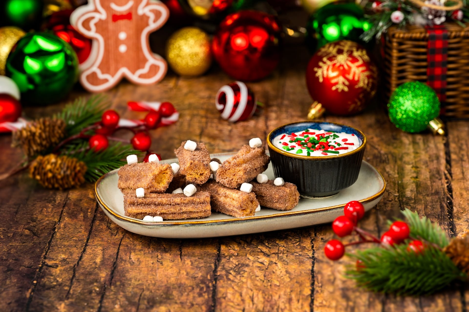 Holiday churros topped with mini marshmallows and festive dip from the 2025 menu at Disney, perfect for Mickey’s holiday party.