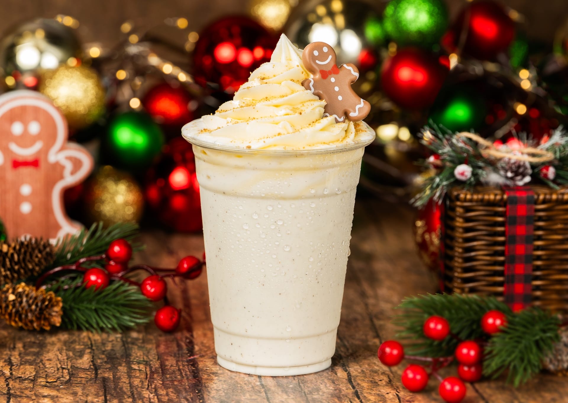 A festive vanilla milkshake with whipped cream and a gingerbread cookie, reminiscent of treats at Walt Disney World’s holiday events.