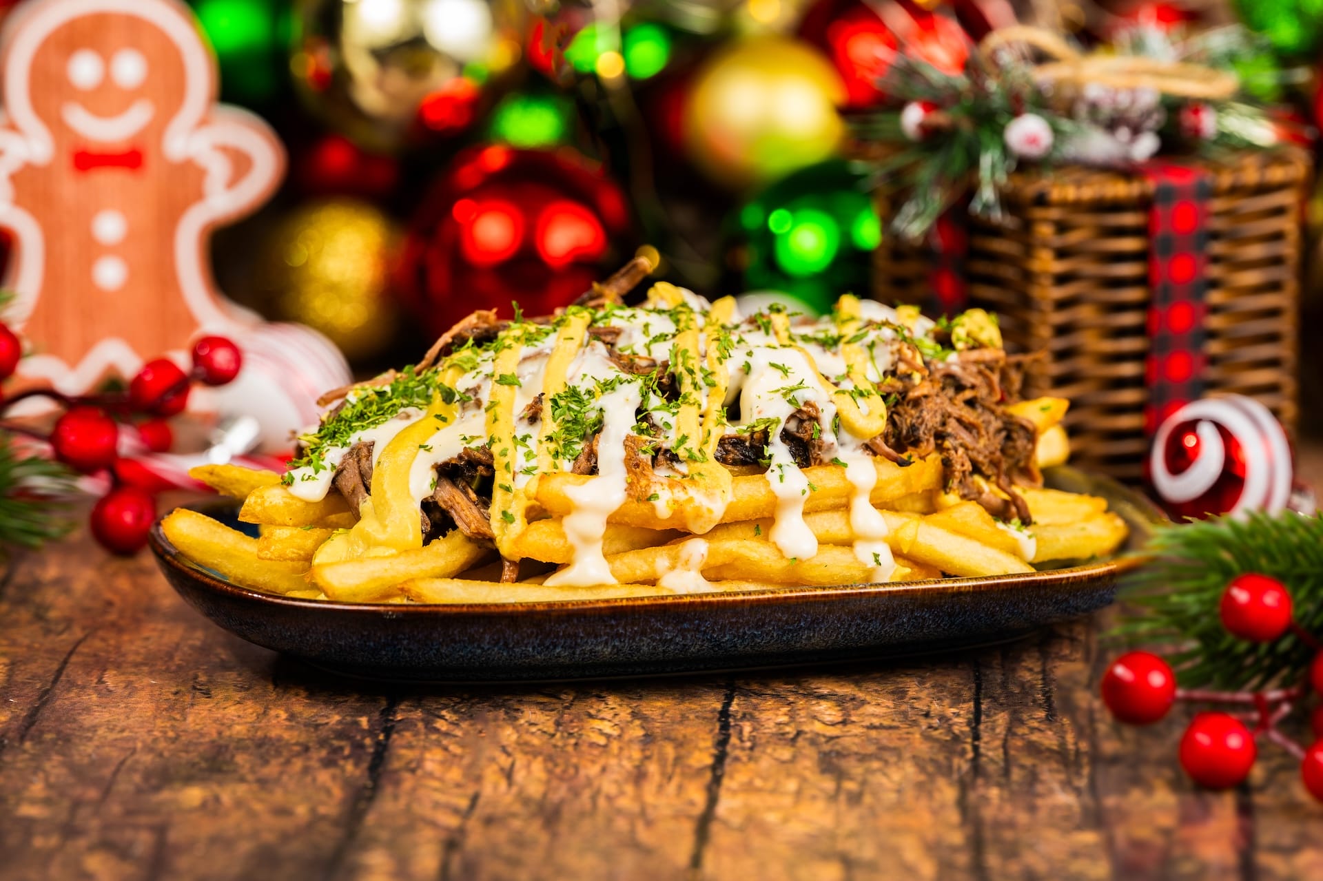 Loaded fries topped with shredded meat, sauce, and herbs—a magical 2025 holiday snack from Walt Disney Parks' festive menu.