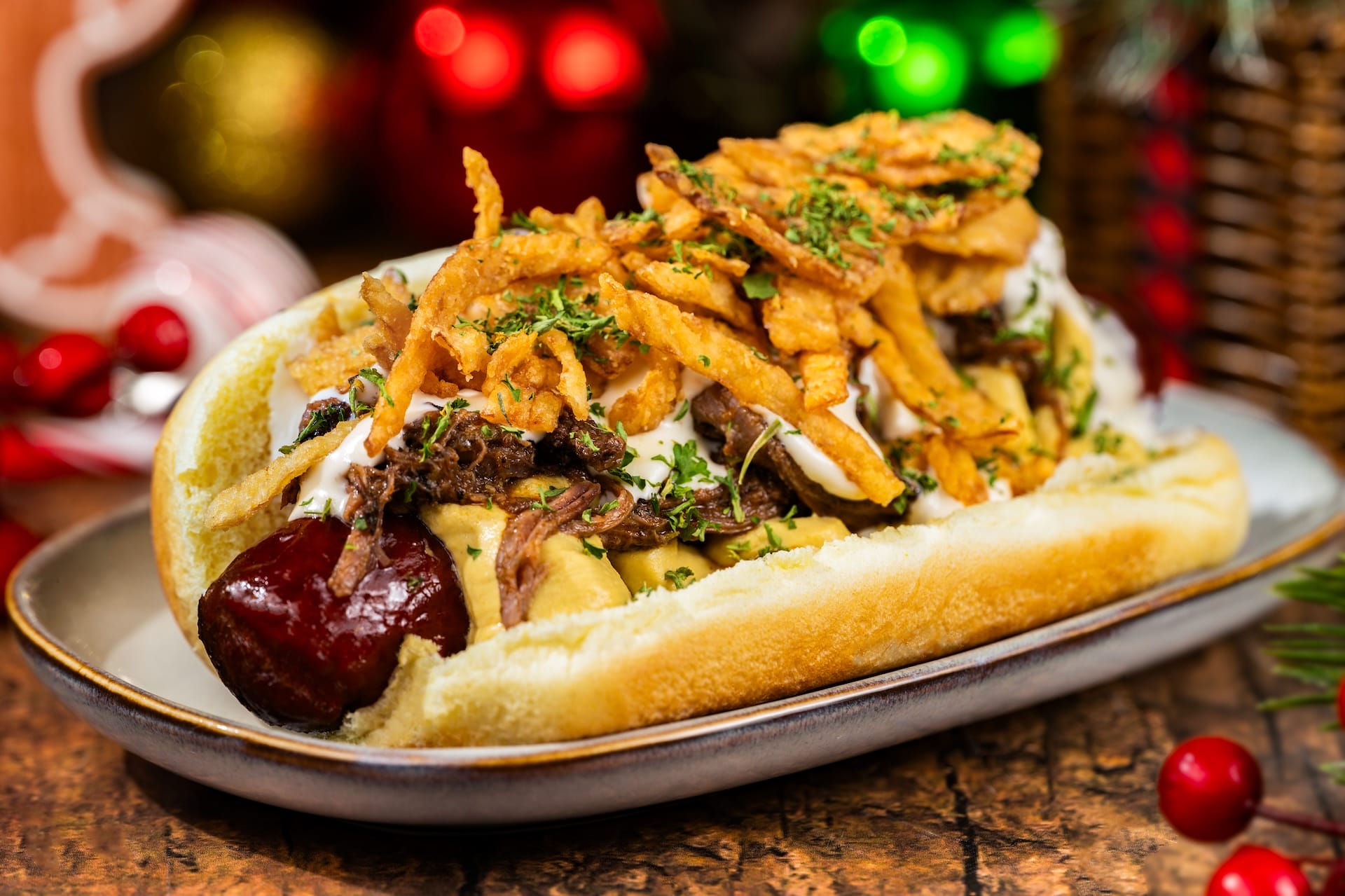 A holiday hot dog with shredded beef, herbs, and crispy onions, a festive treat exclusive to Disney parks during Christmas events.