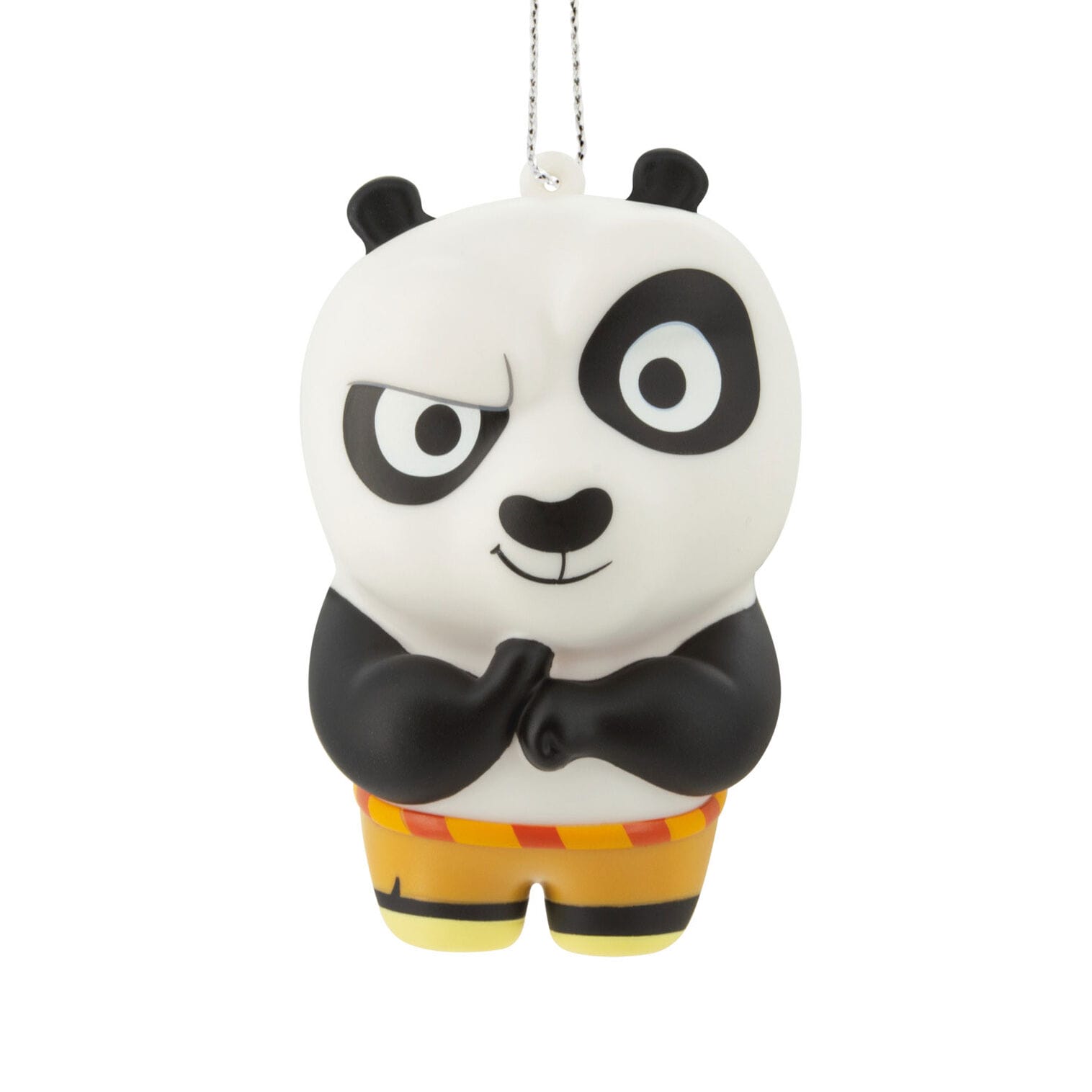 A cartoon panda ornament with crossed arms, wearing yellow shorts, from Hallmark’s Movie Moments