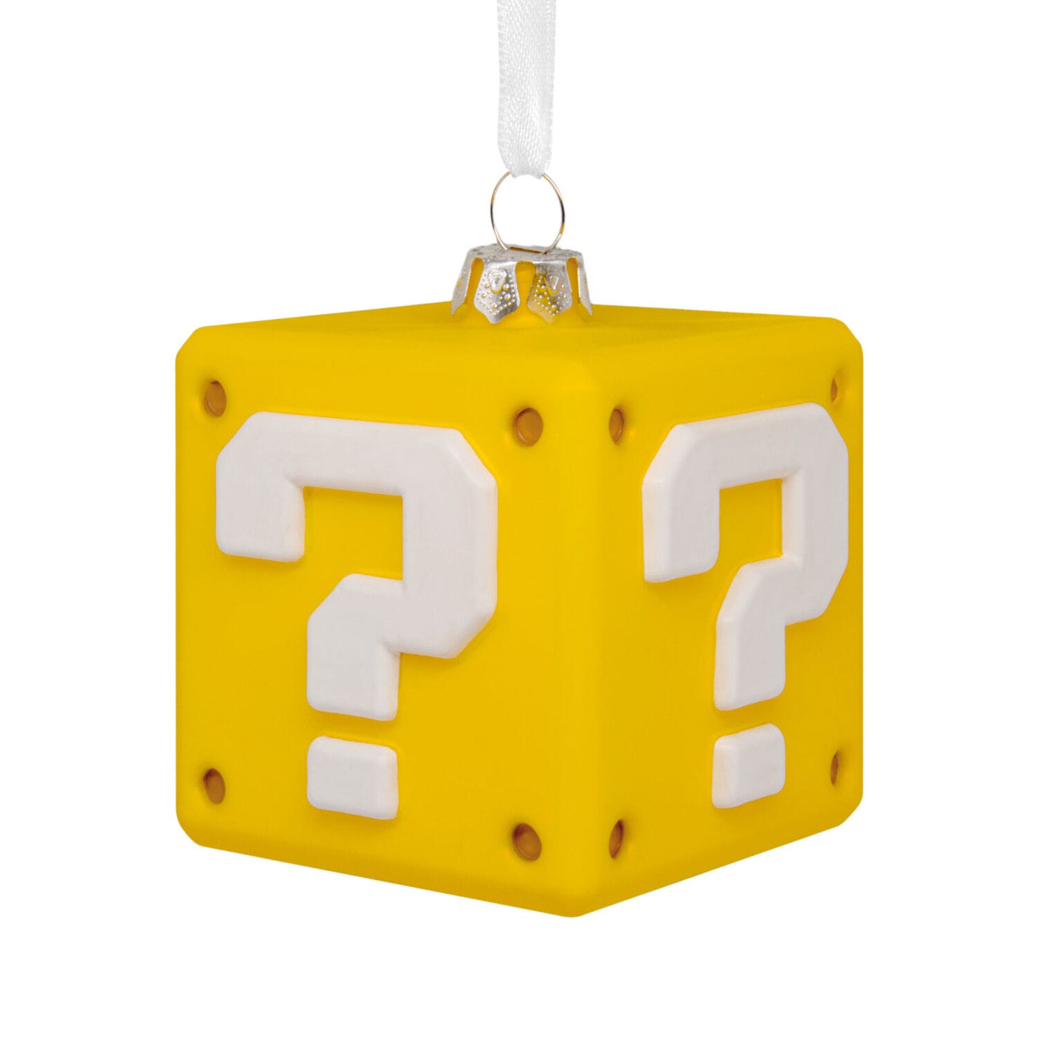 A yellow cube ornament with white question marks, reminiscent of a video game block