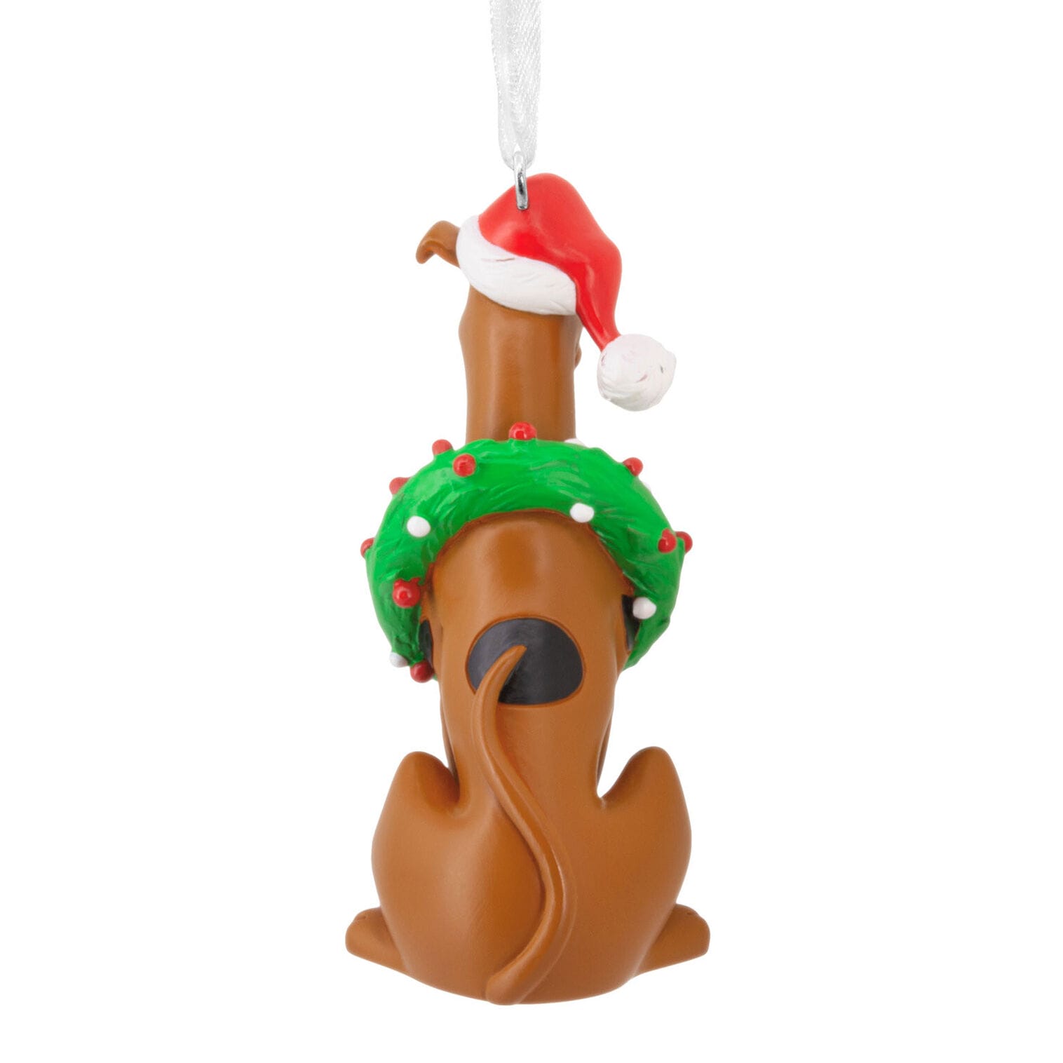 Cartoon dog ornament in Santa hat and wreath decor, hangs from a silver ribbon.