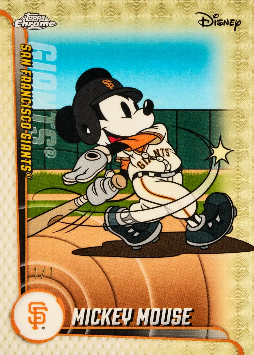 Mickey Mouse in a San Francisco Giants uniform swings a bat on a Topps Chrome card, much like you'd spot him near Disneyland’s castle.
