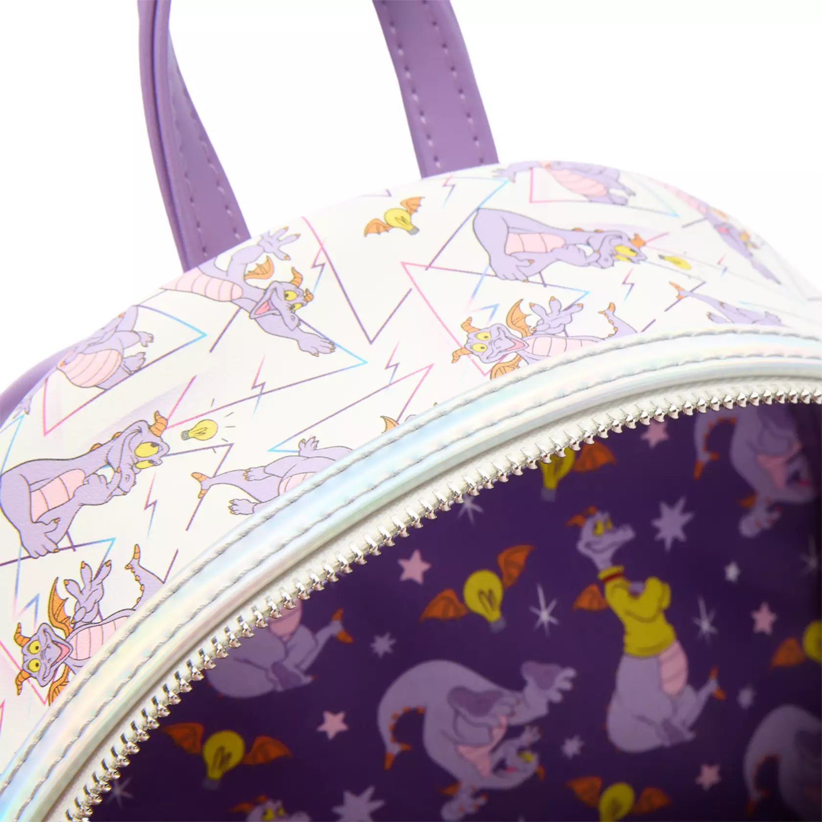Close-up of a Figment Loungefly backpack at Disney Springs, featuring pastel dragons and purple dragon lining, no castle visible.